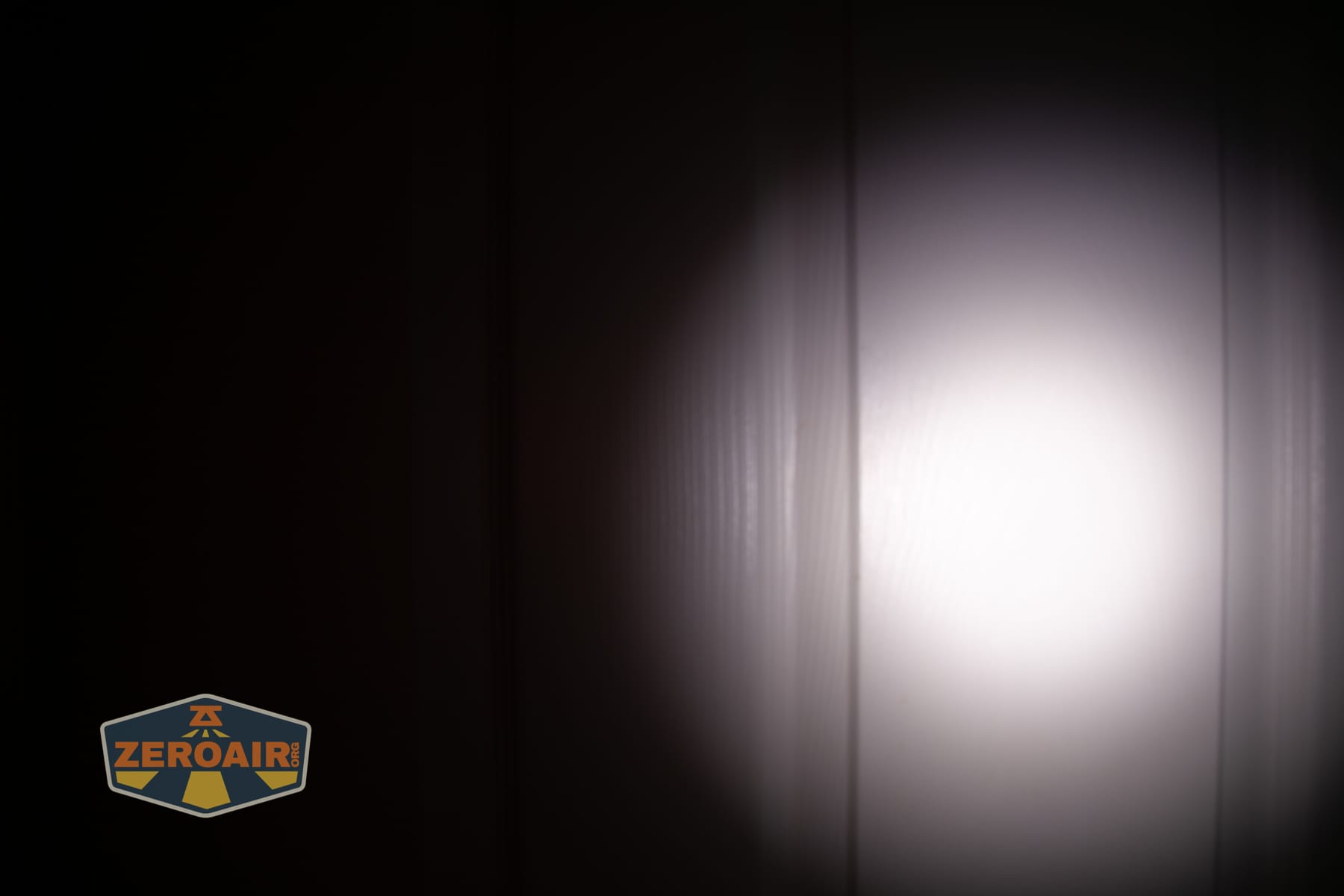 Acebeam UC3A Signal flashlight beamshots on door (at 1') compared to nichia 219b 4500K