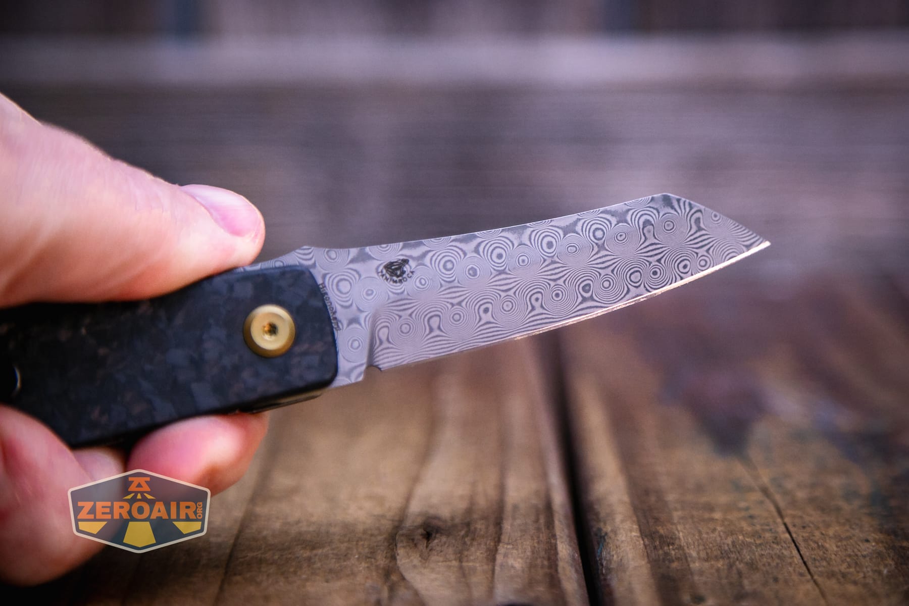 Kansept Higonokami liner lock knife open in hand blade detail