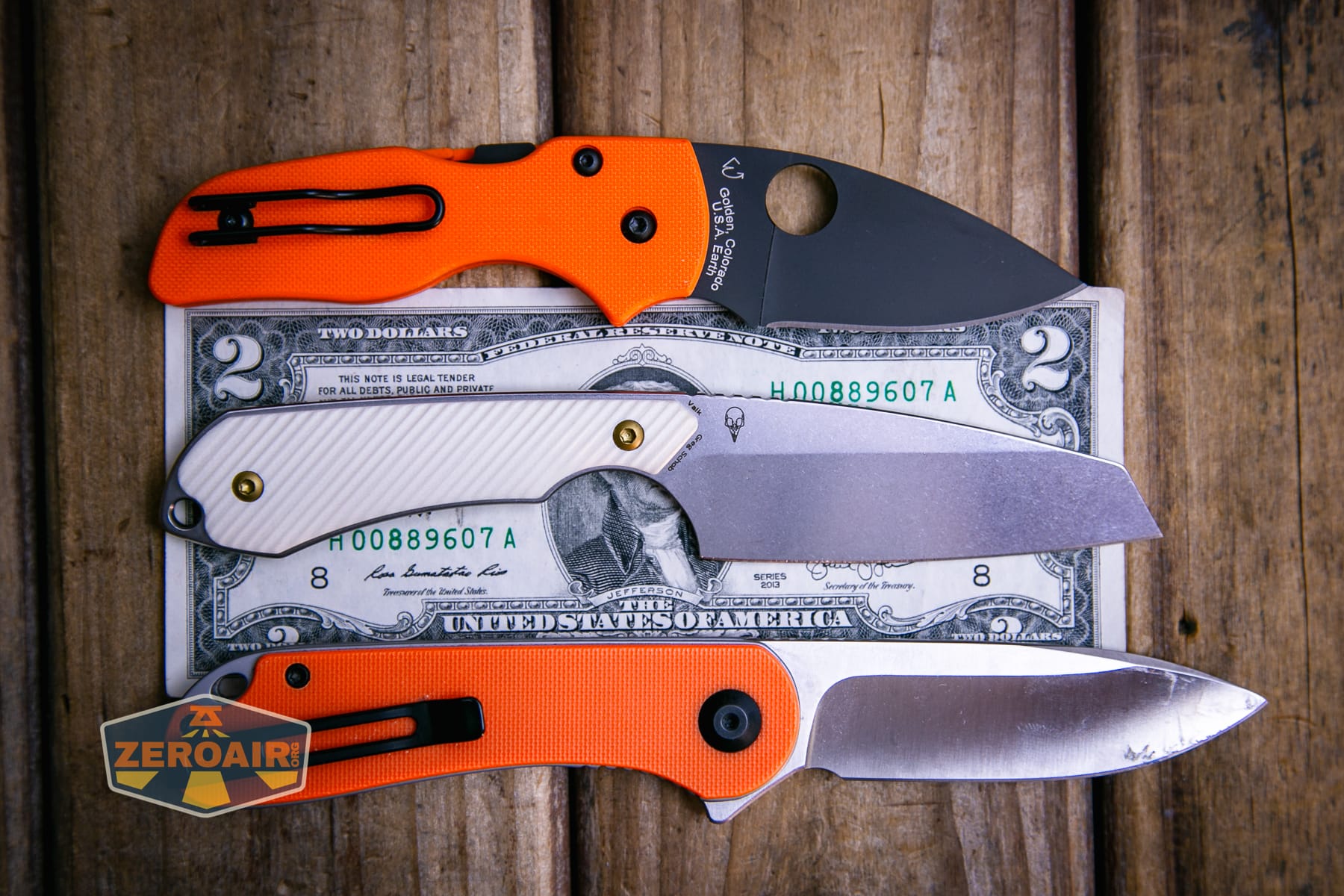 Kansept Valk Fixed blade knife compared to Civivi Elementum in orange on a two dollar bill