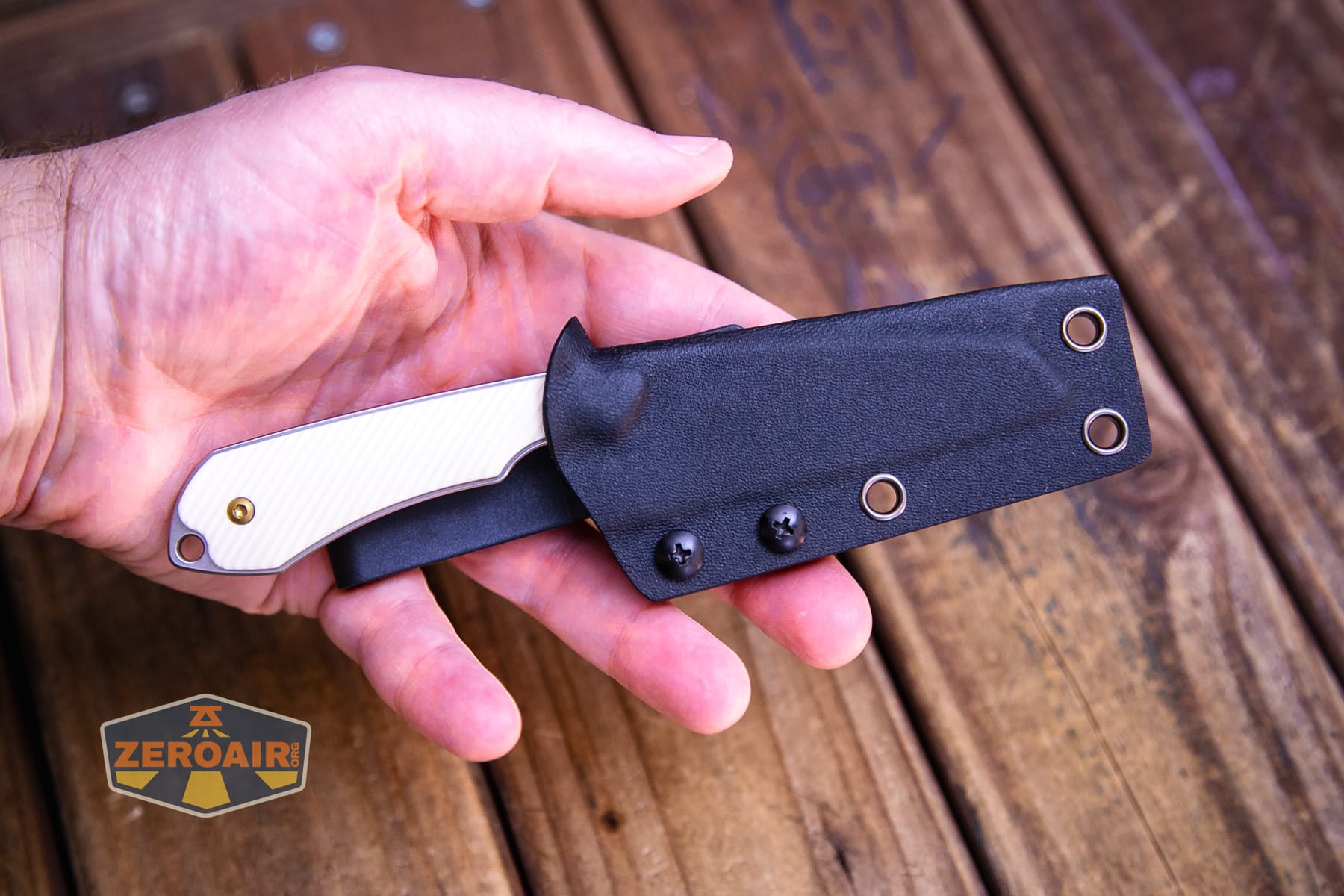 Kansept Valk Fixed blade knife in sheath in hand