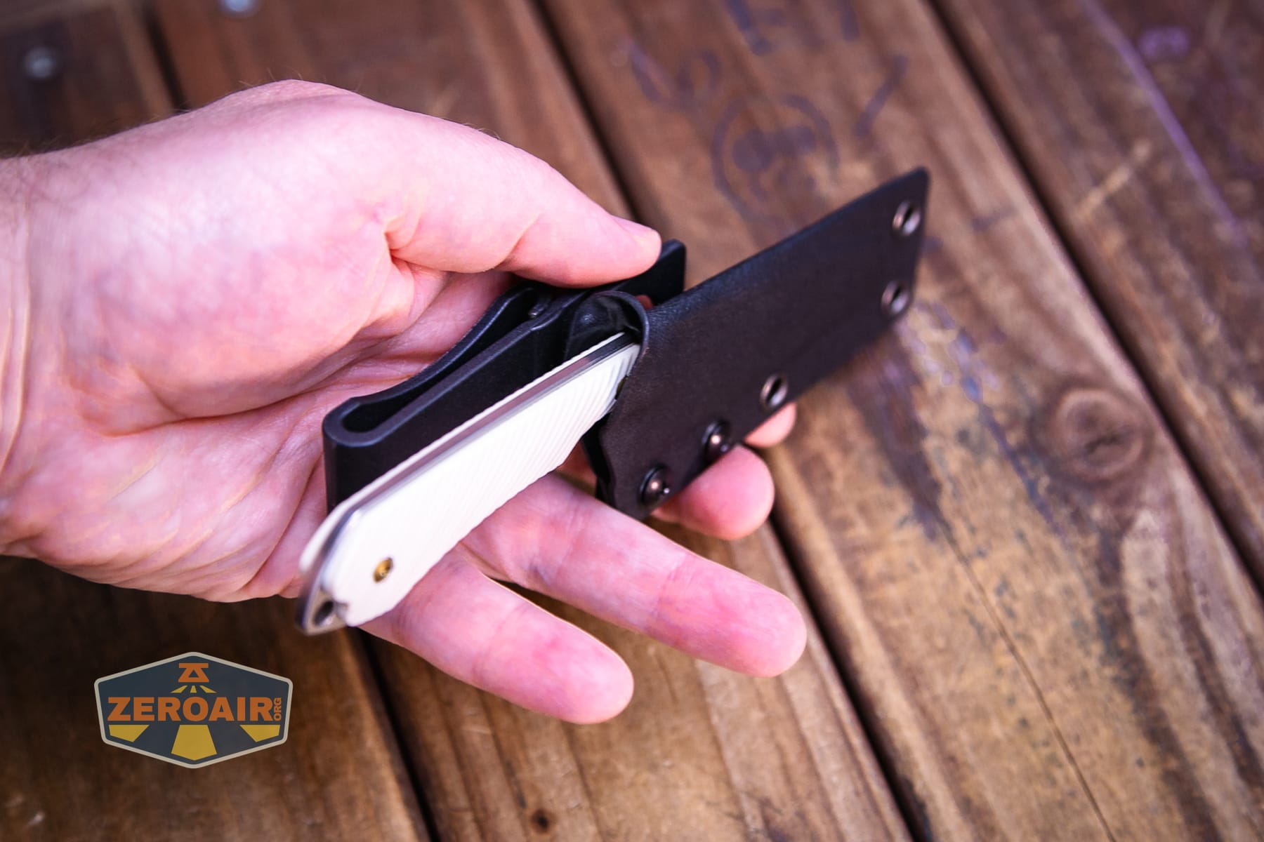 Kansept Valk Fixed blade knife in sheath in hand