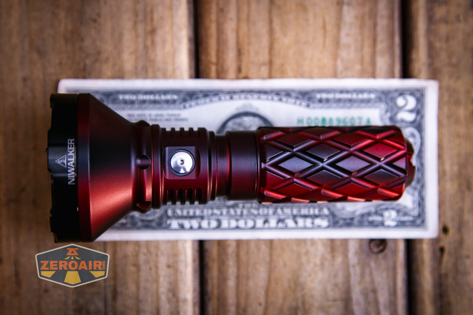 Niwalker N01 Max flashlight on a two dollar bill