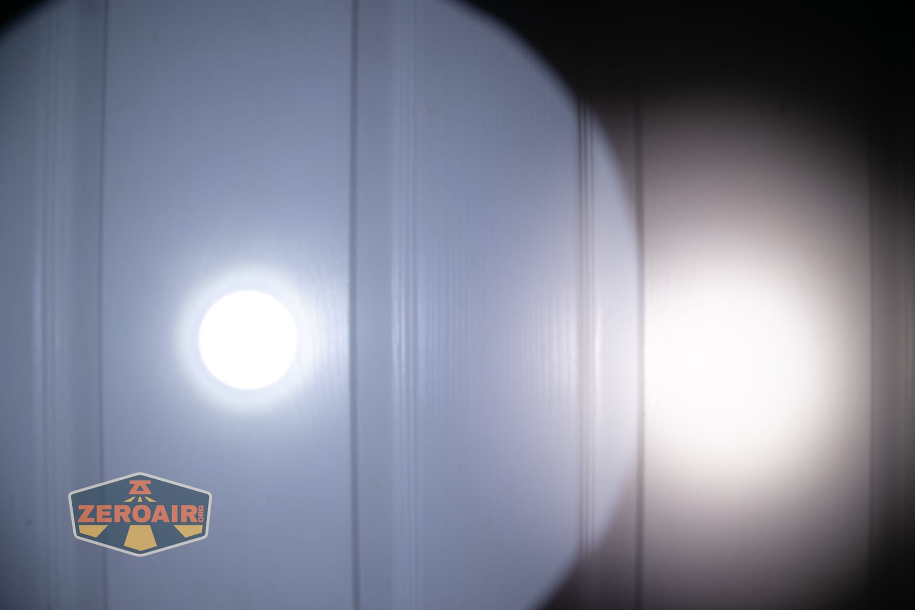 Niwalker N01 Max flashlight beamshots on door (at 1') compared to nichia 219b 4500K