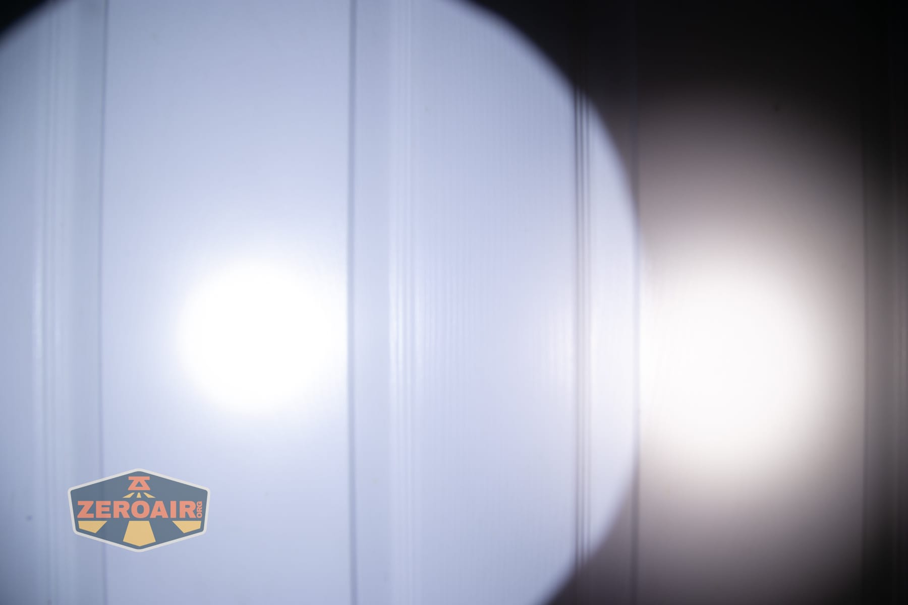 Niwalker N01 Max flashlight beamshots on door (at 1') compared to nichia 219b 4500K
