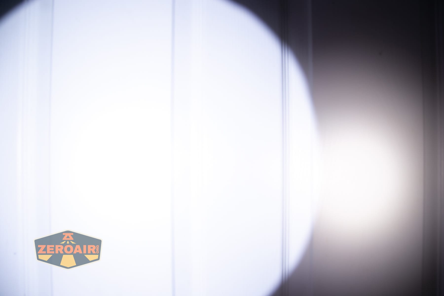 Niwalker N01 Max flashlight beamshots on door (at 1') compared to nichia 219b 4500K