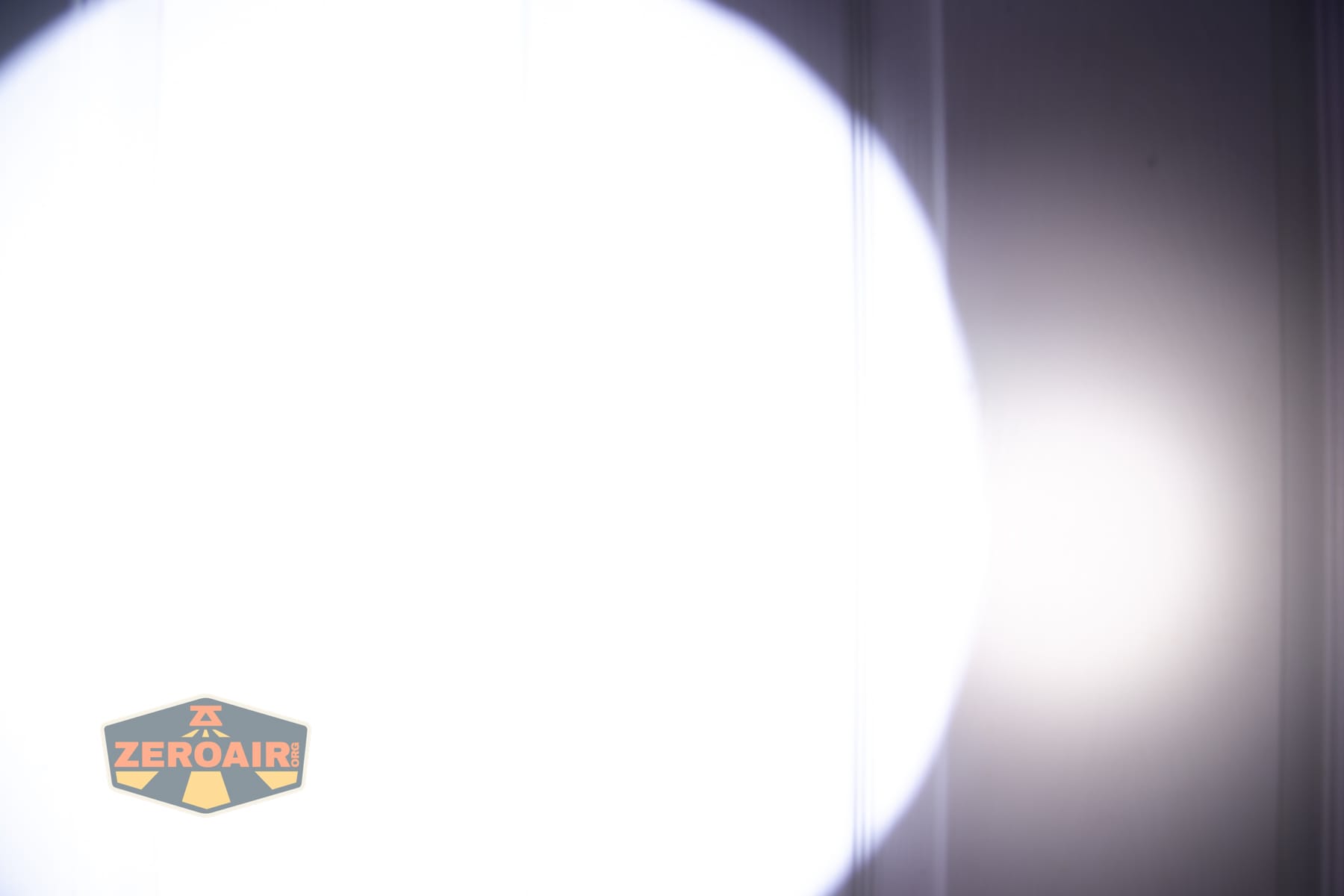 Niwalker N01 Max flashlight beamshots on door (at 1') compared to nichia 219b 4500K