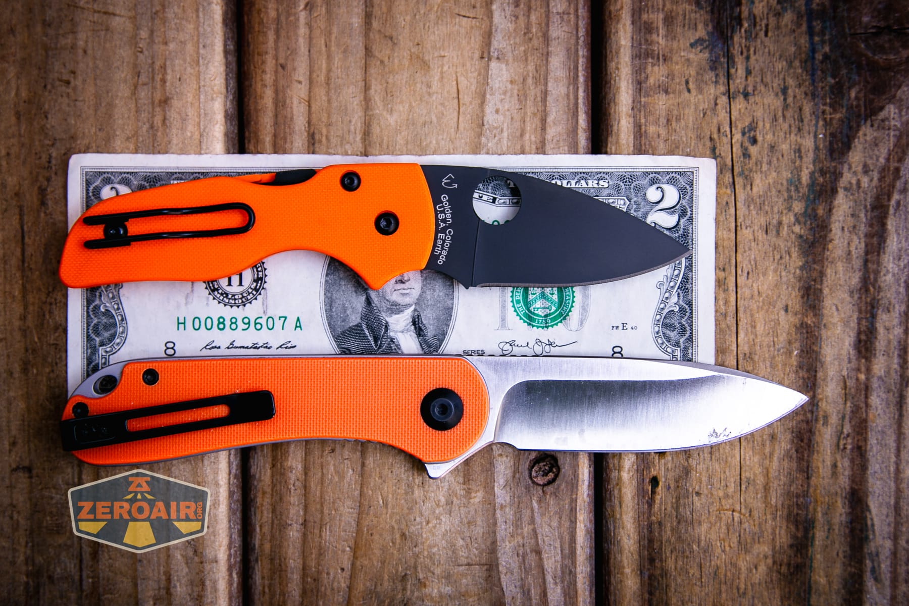 Spyderco Lil Native Cutlery Shoppe knife on a two dollar bill compared to Civivi Elementum in orange
