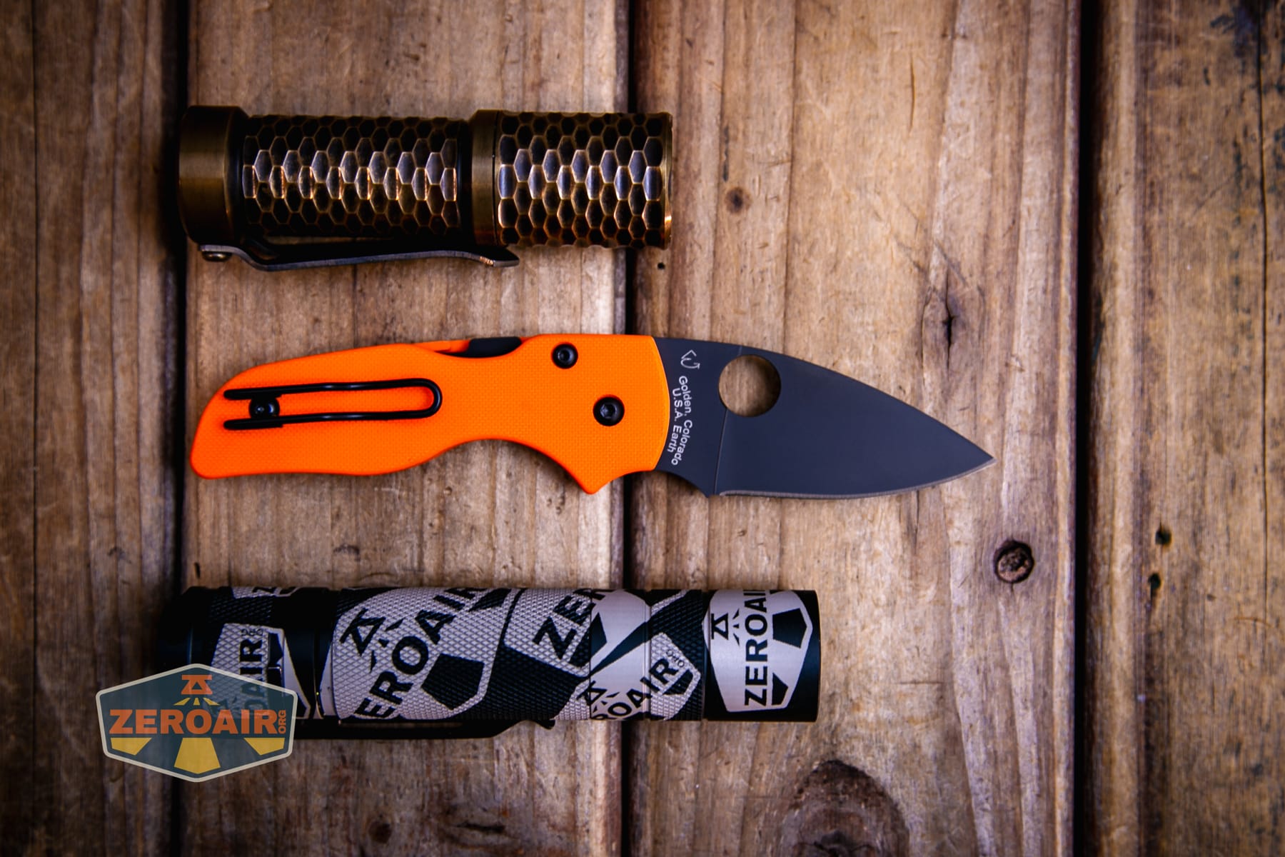 Spyderco Lil Native Cutlery Shoppe knife with two standard sized flashlights