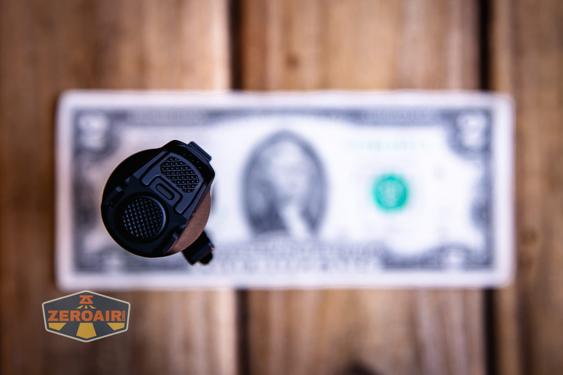 Nitecore P27iX customizable tactical flashlight on two dollar bill