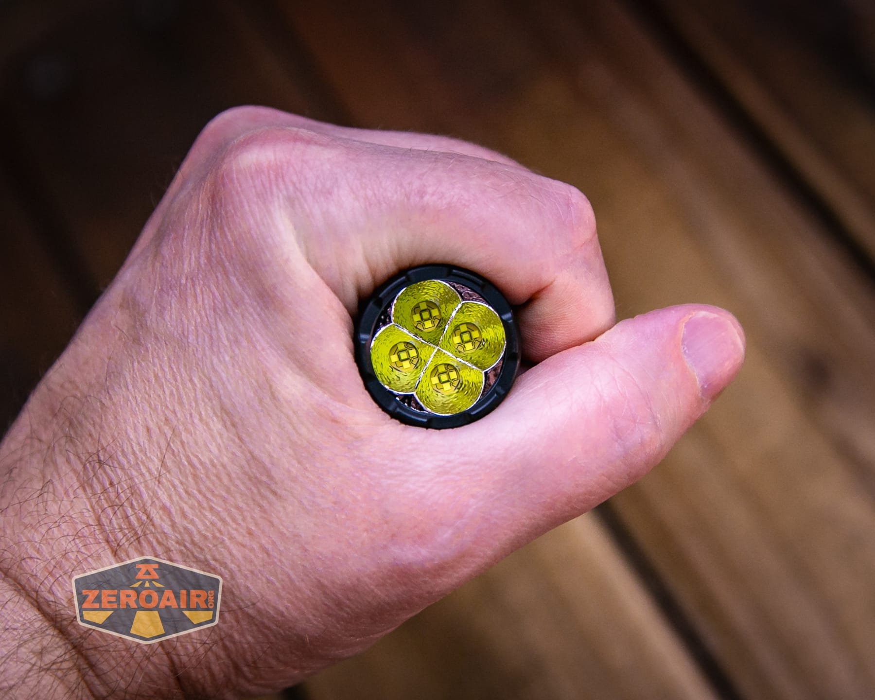 Nitecore P27iX customizable tactical flashlight in hand