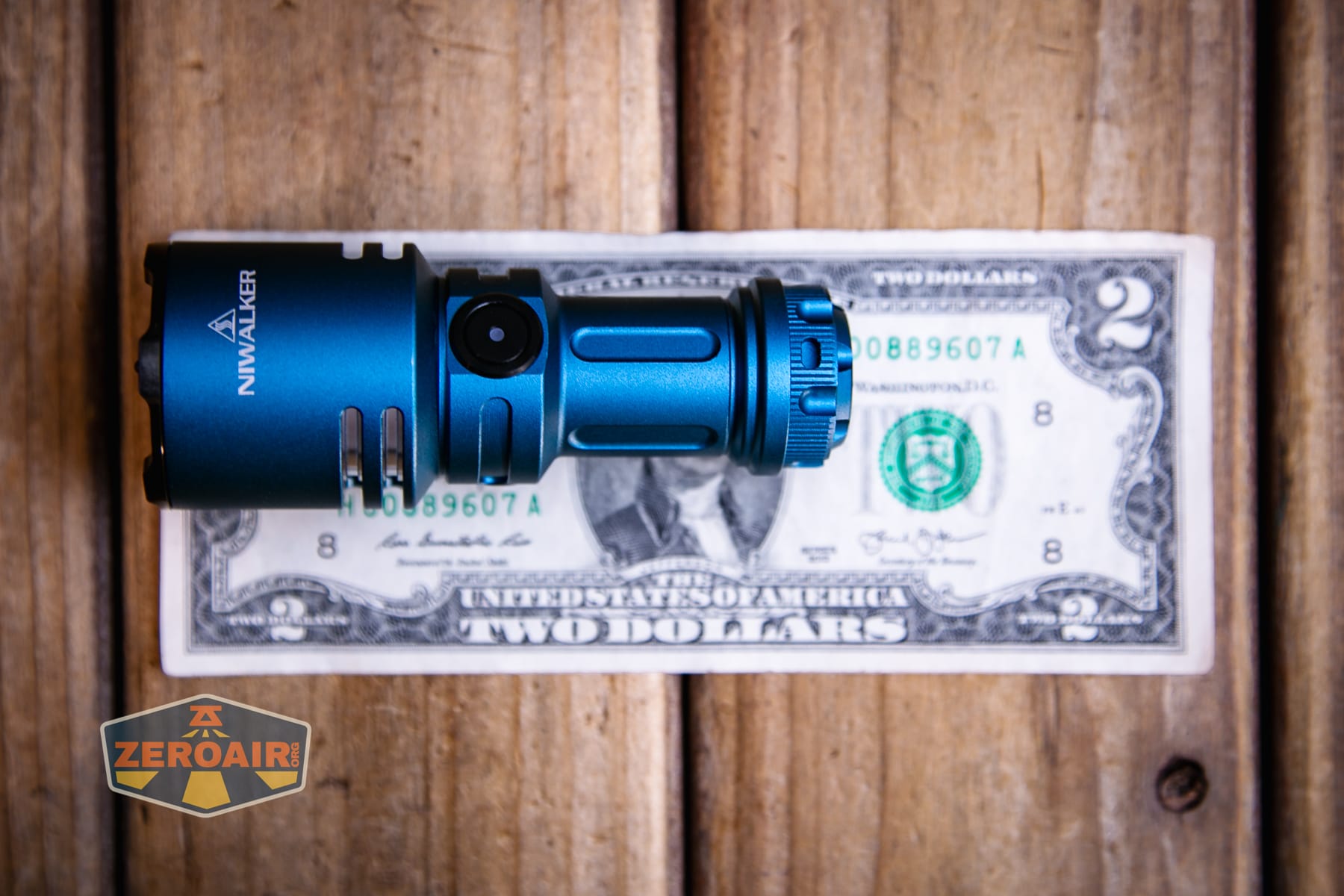 Niwalker N50S long range flashlight on two dollar bill