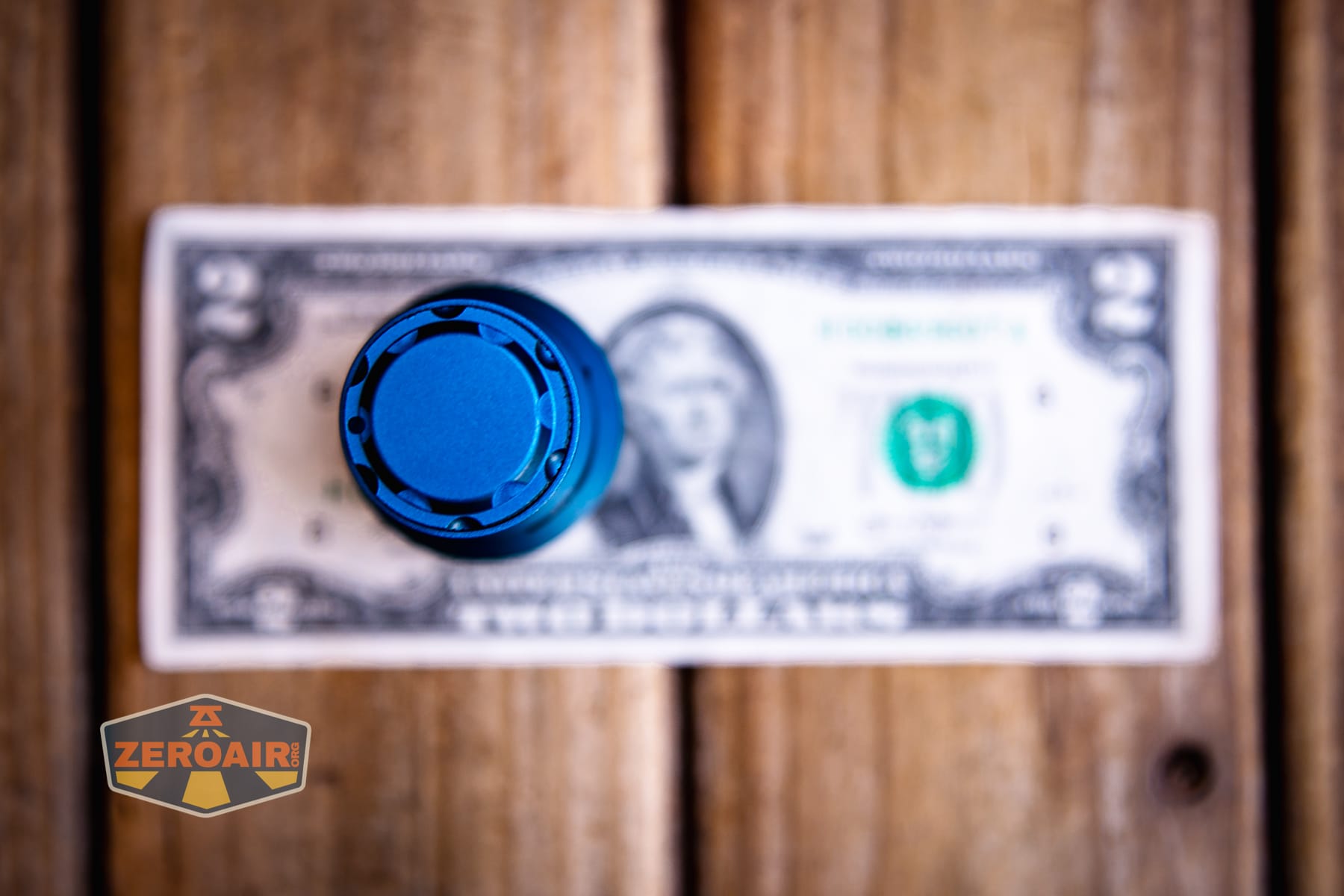 Niwalker N50S long range flashlight on two dollar bill