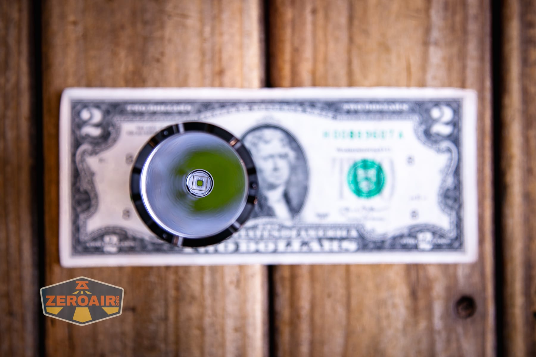 Niwalker N50S long range flashlight on two dollar bill