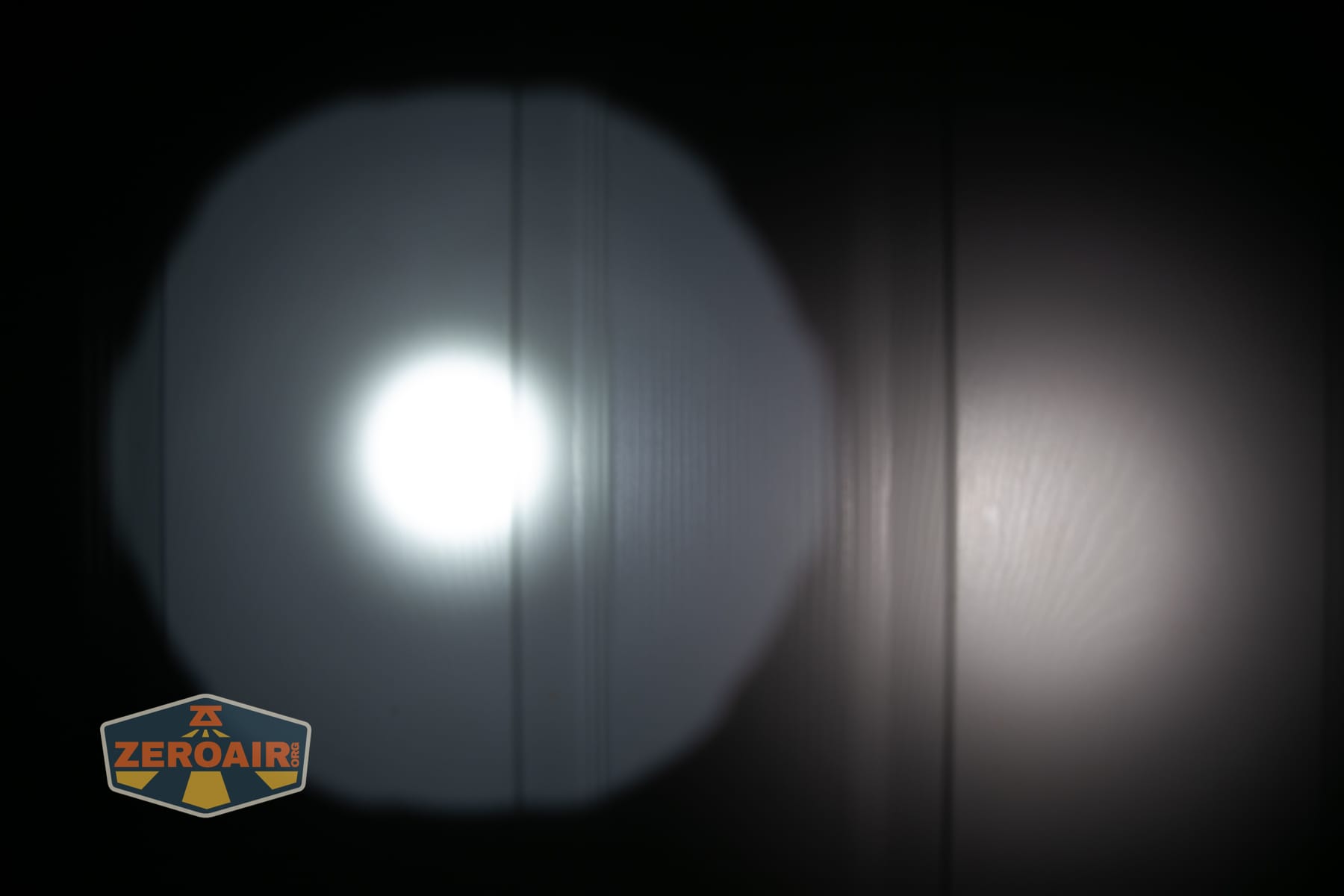 Niwalker N50S long range flashlight beamshots on door compared to nichia 219b