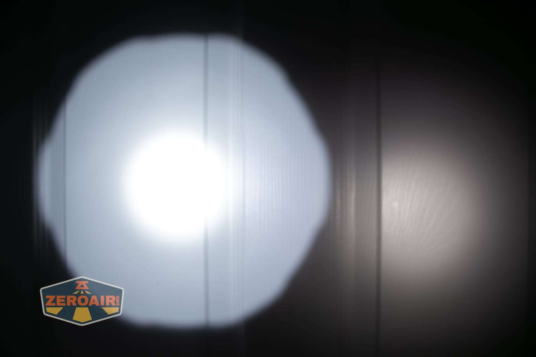 Niwalker N50S long range flashlight beamshots on door compared to nichia 219b