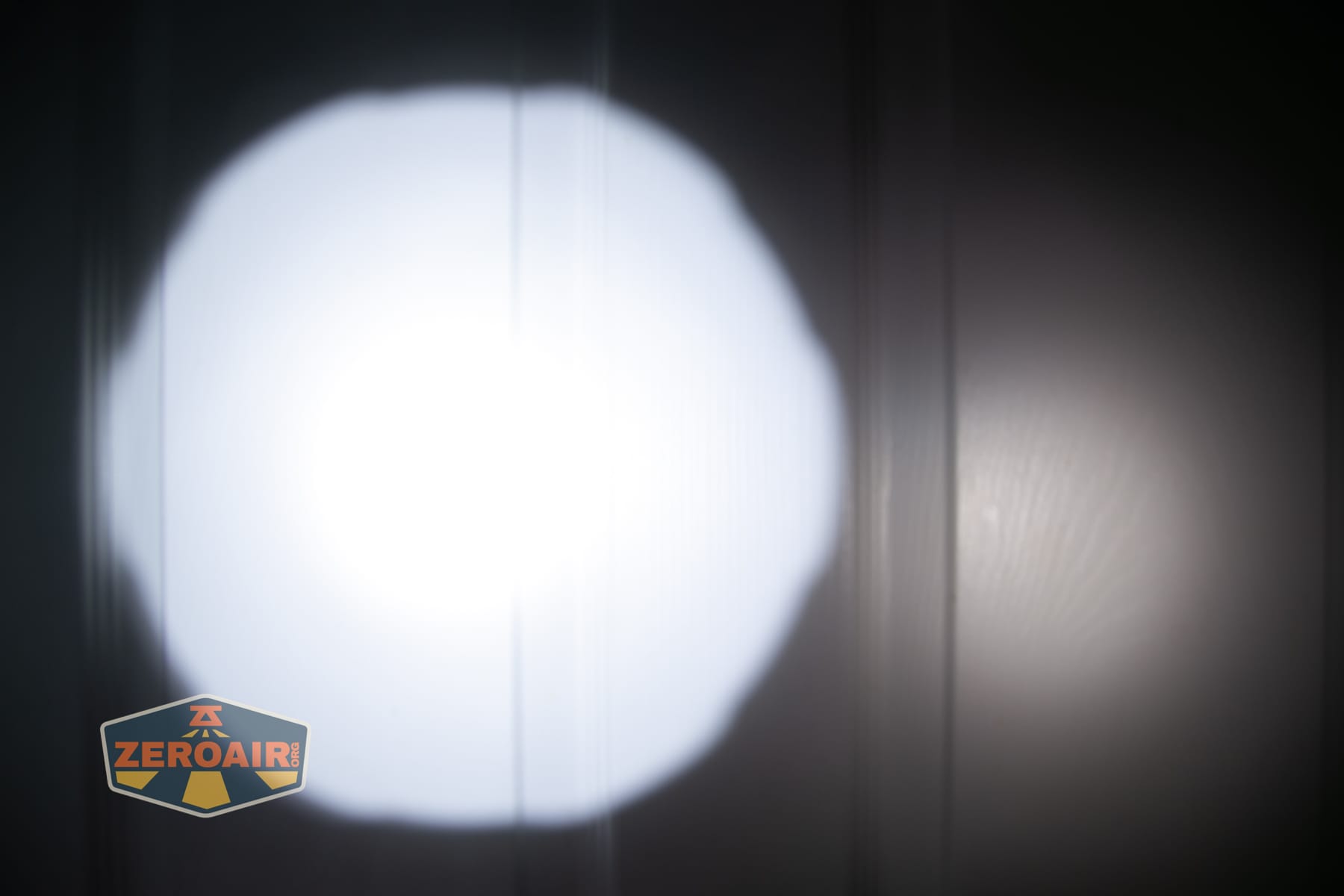 Niwalker N50S long range flashlight beamshots on door compared to nichia 219b