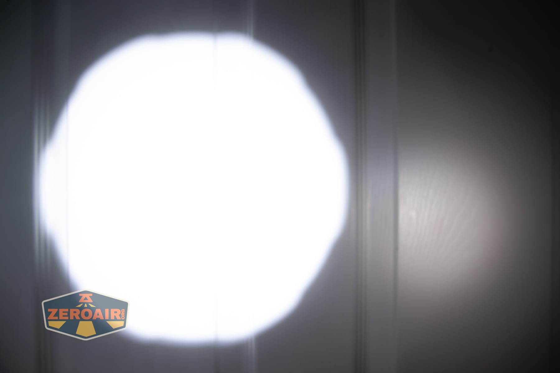Niwalker N50S long range flashlight beamshots on door compared to nichia 219b