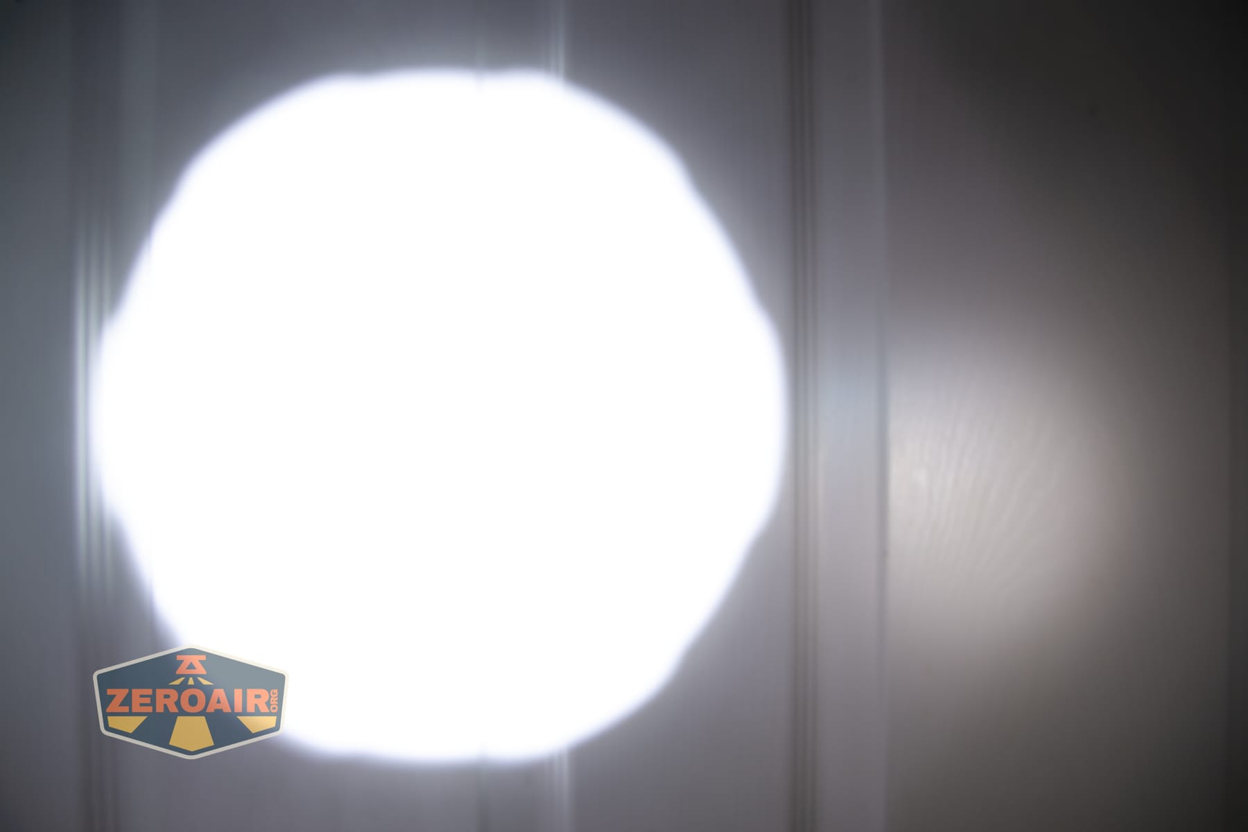 Niwalker N50S long range flashlight beamshots on door compared to nichia 219b