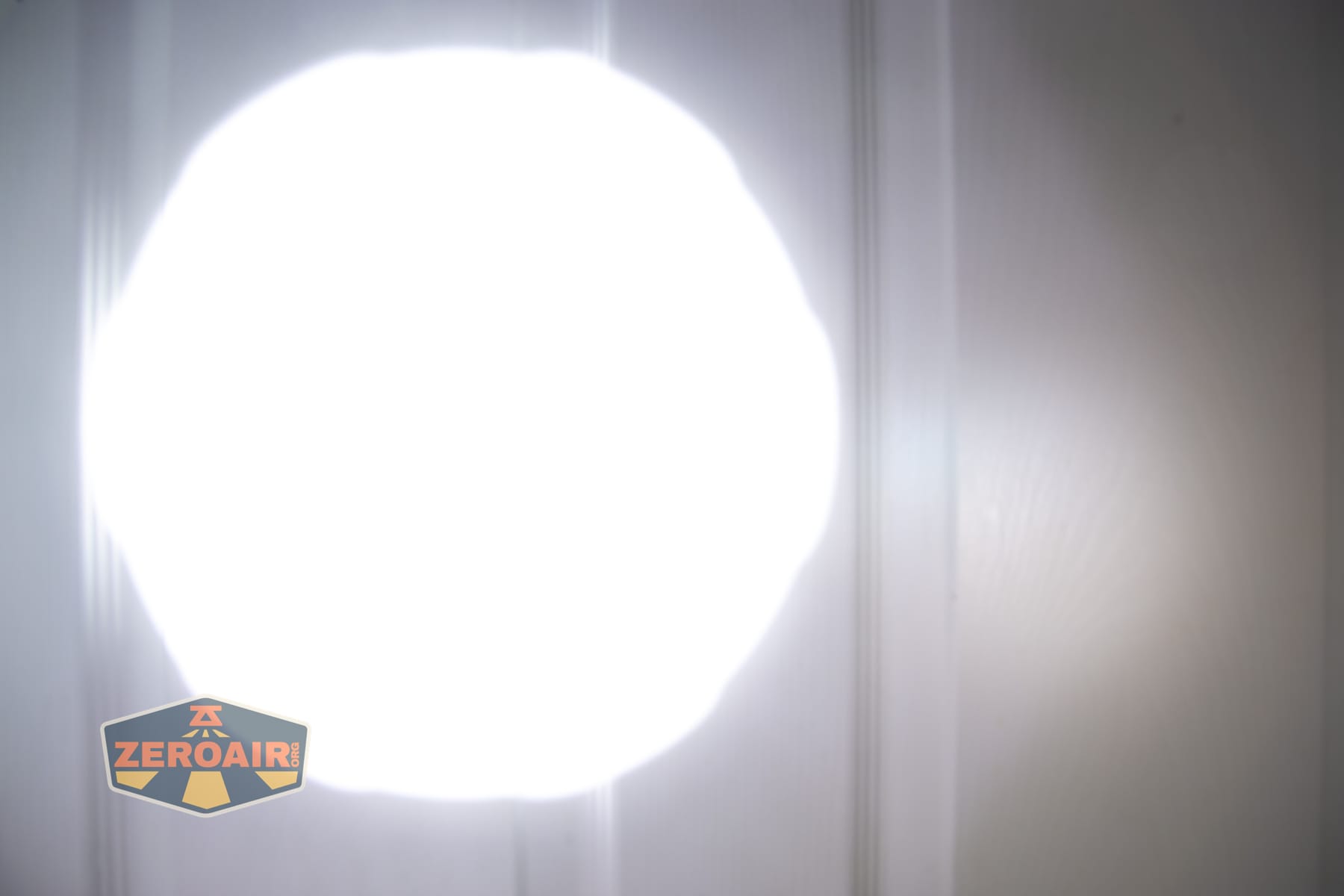 Niwalker N50S long range flashlight beamshots on door compared to nichia 219b