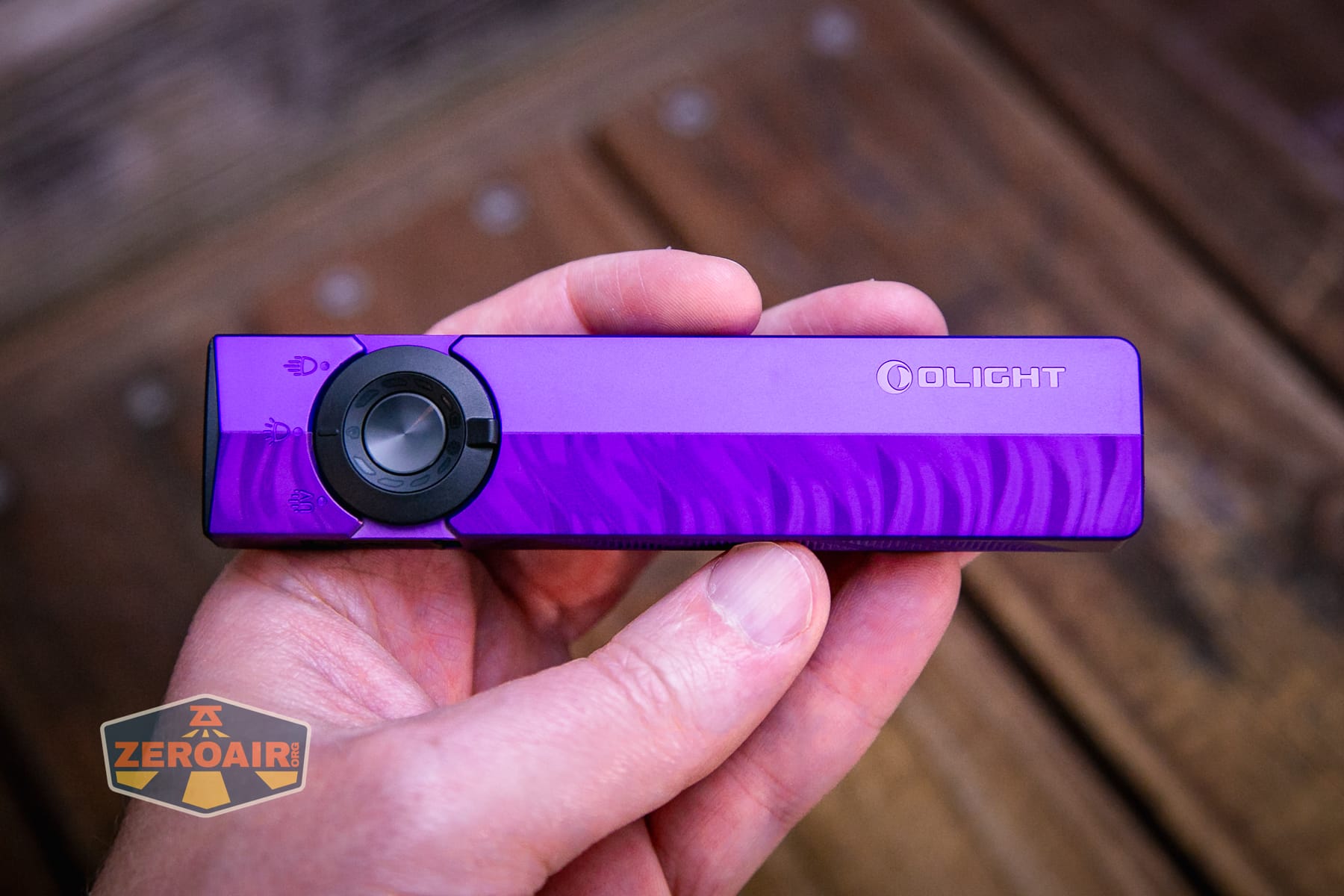 Olight ArkPro Nebula Violet Flat flashlight in hand