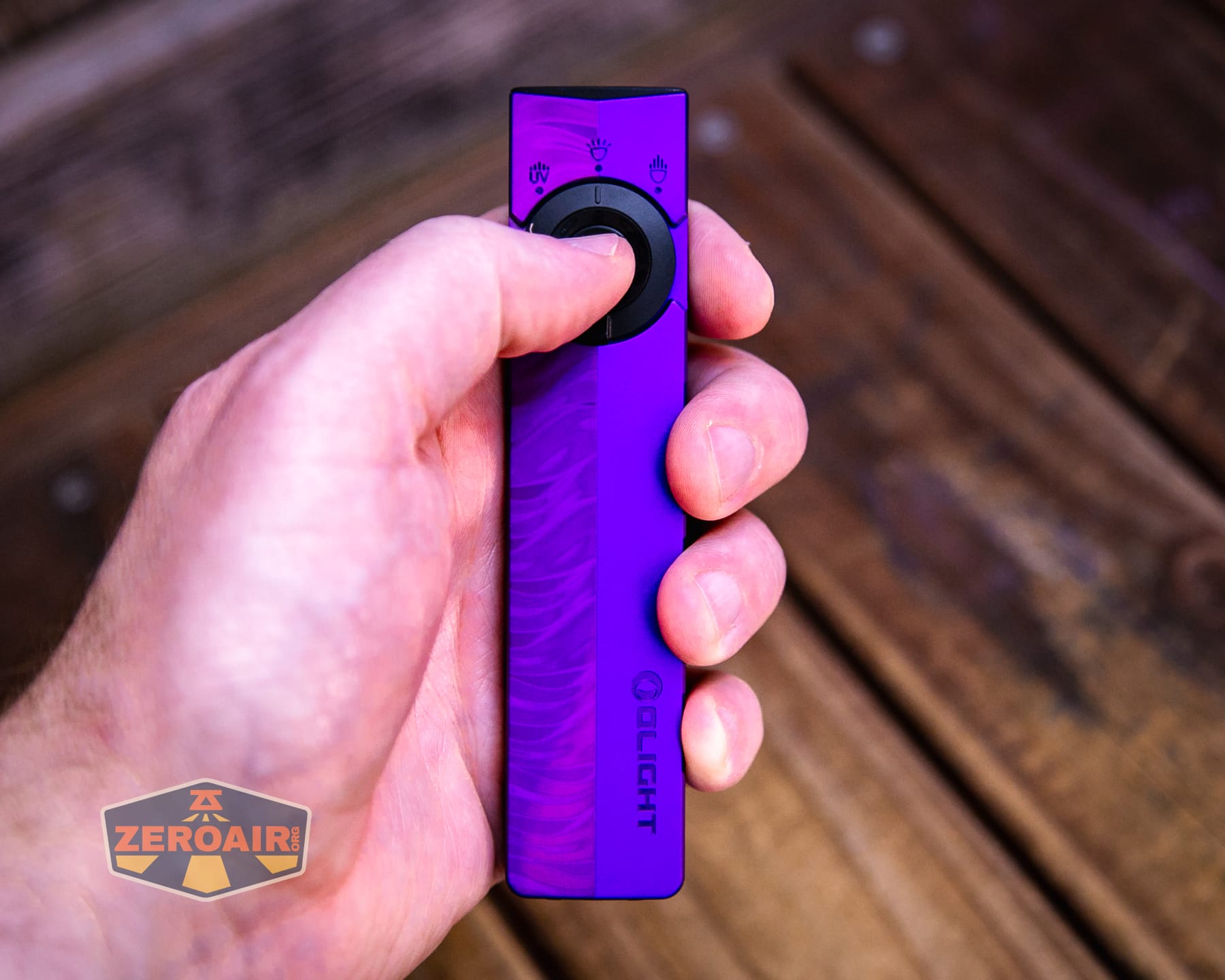 Olight ArkPro Nebula Violet Flat flashlight in hand