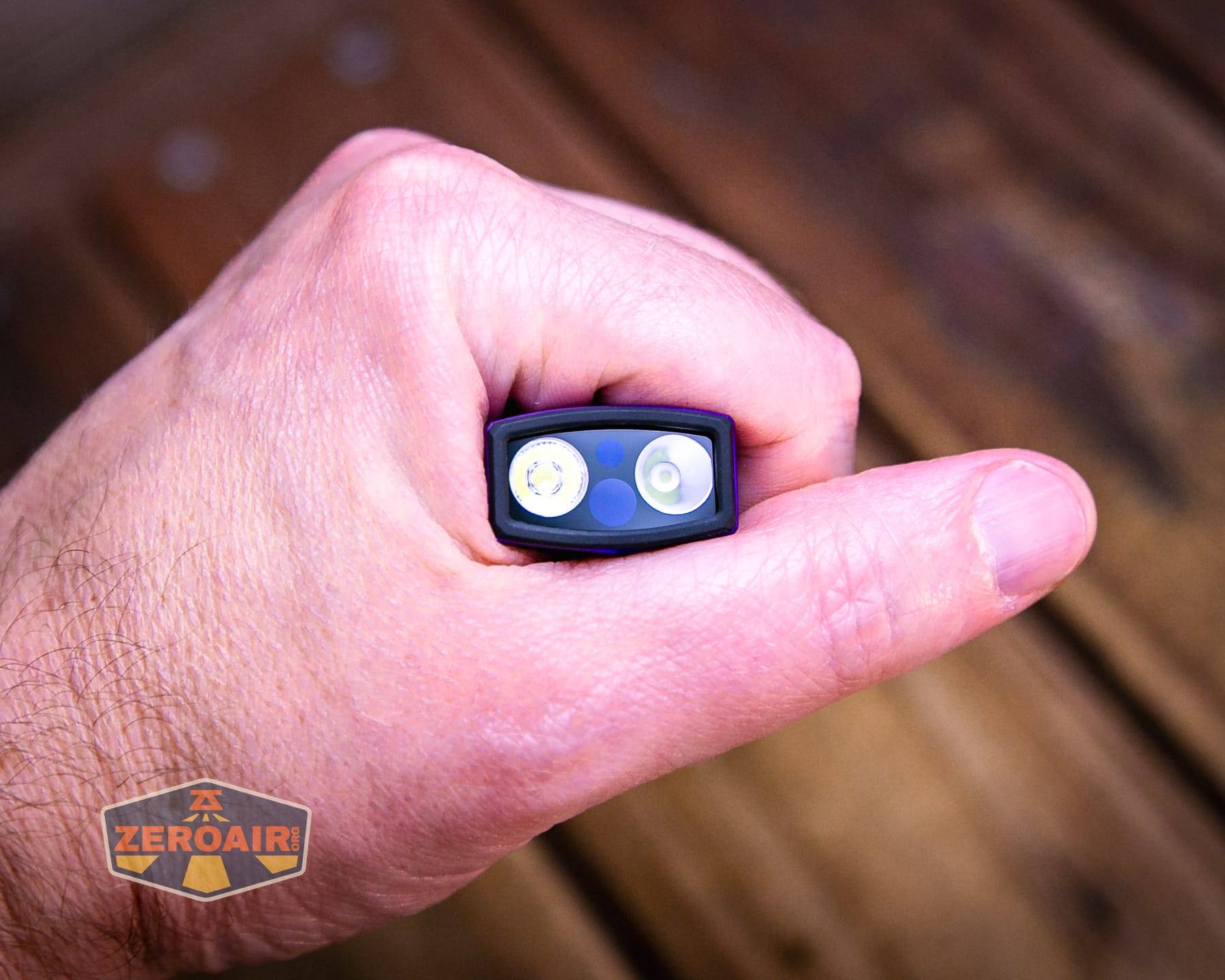 Olight ArkPro Nebula Violet Flat flashlight in hand