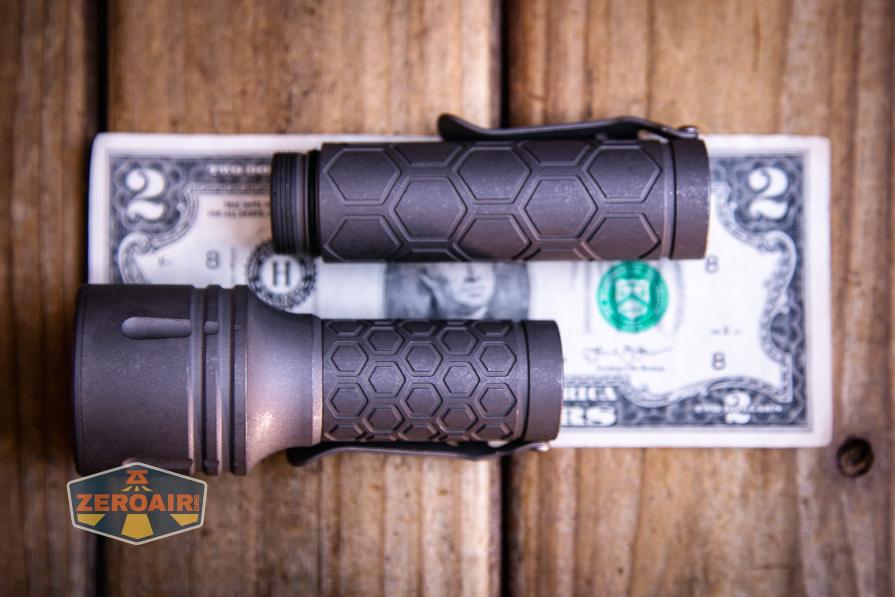 Reylight Dawn Max titanium flashlight on a two dollar bill