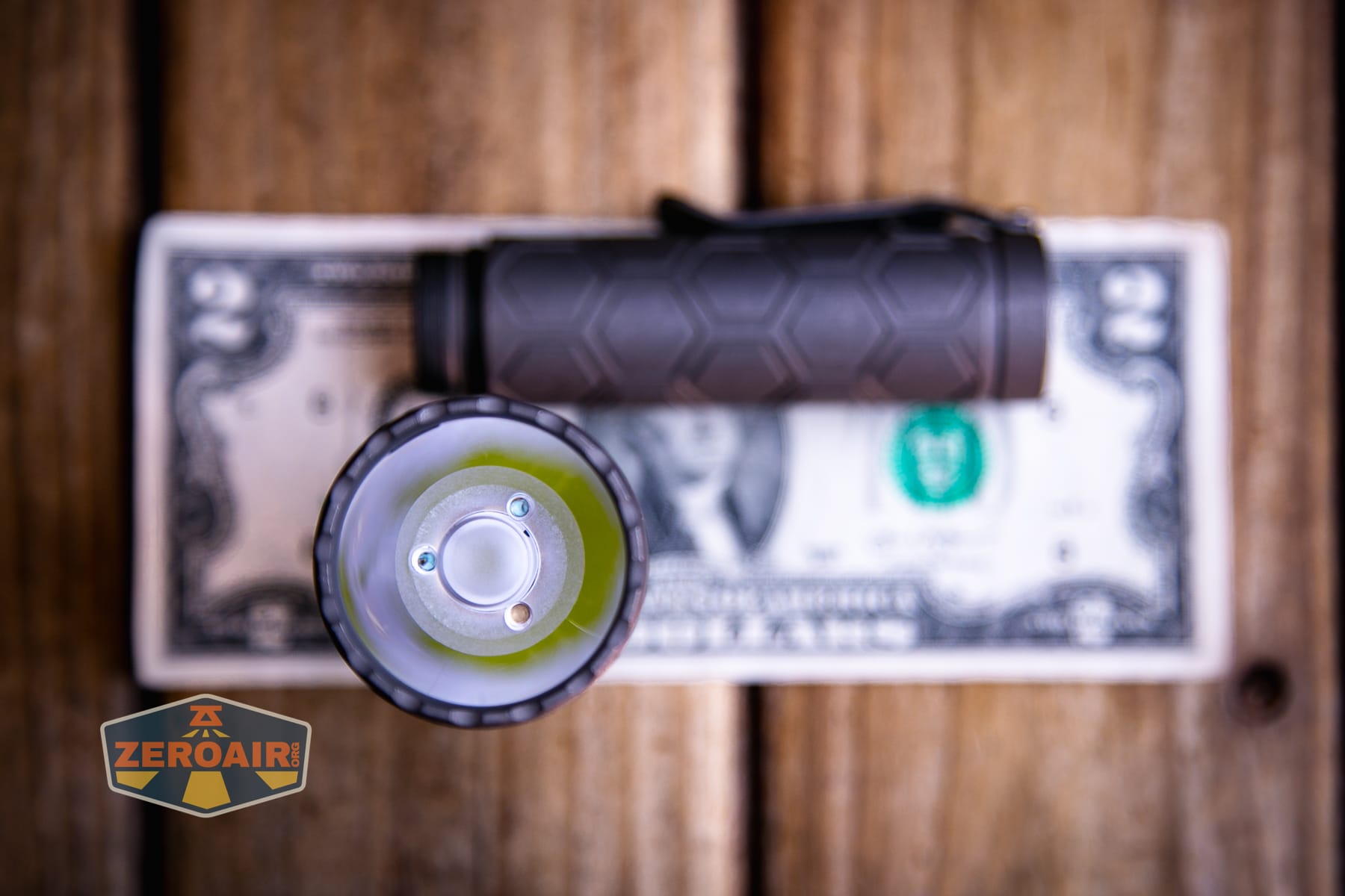 Reylight Dawn Max titanium flashlight on a two dollar bill