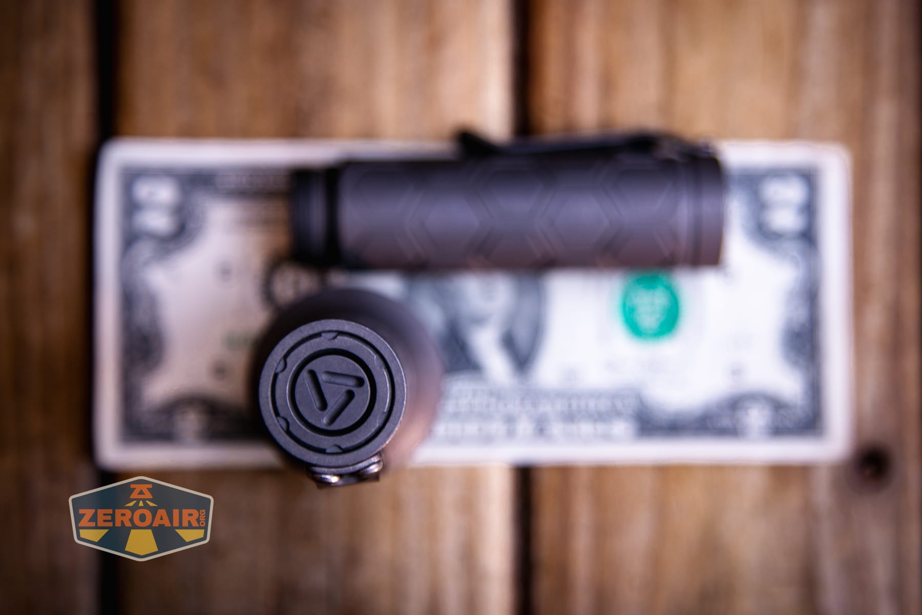Reylight Dawn Max titanium flashlight on a two dollar bill