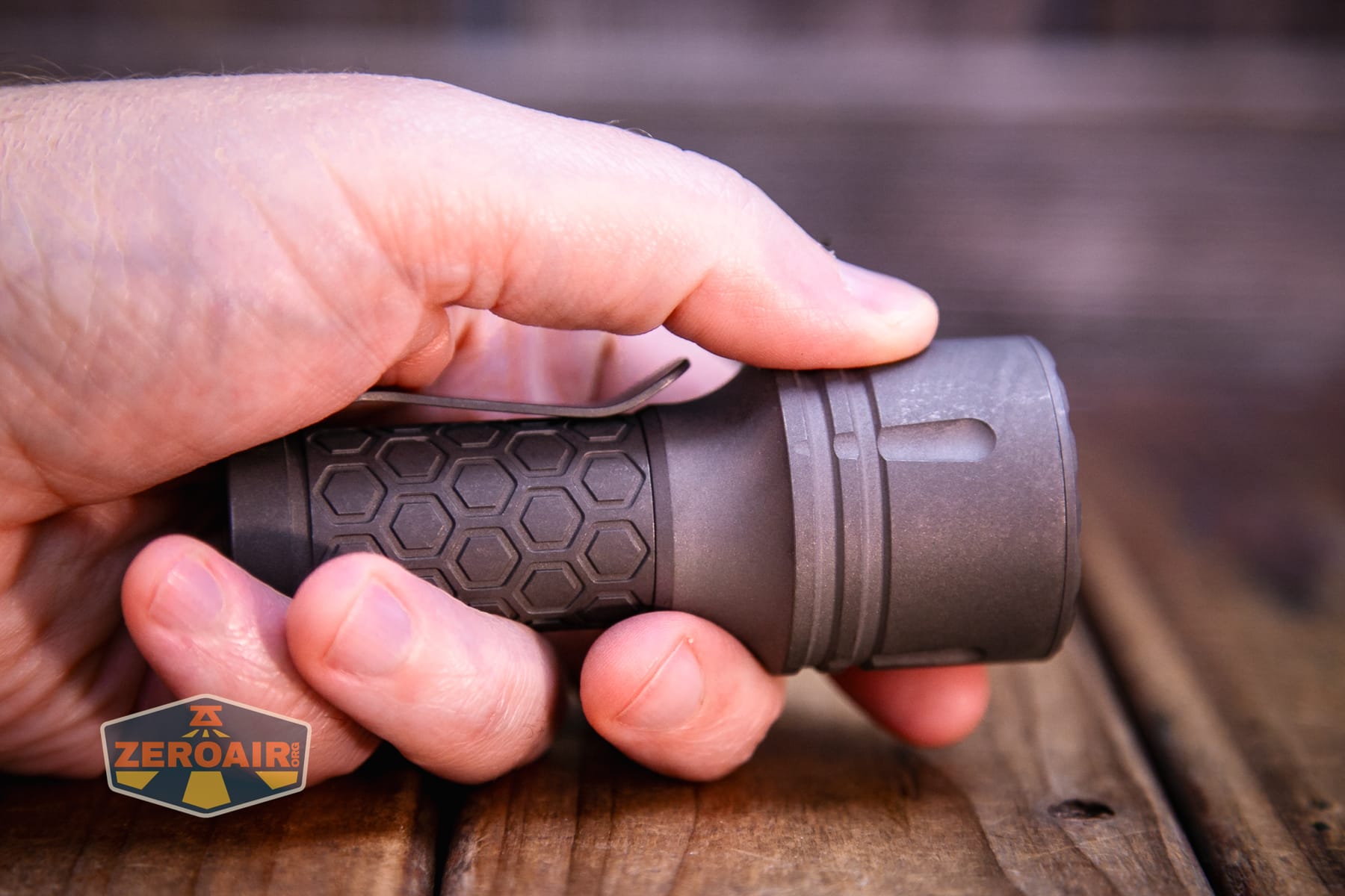 Reylight Dawn Max titanium flashlight in hand 18350