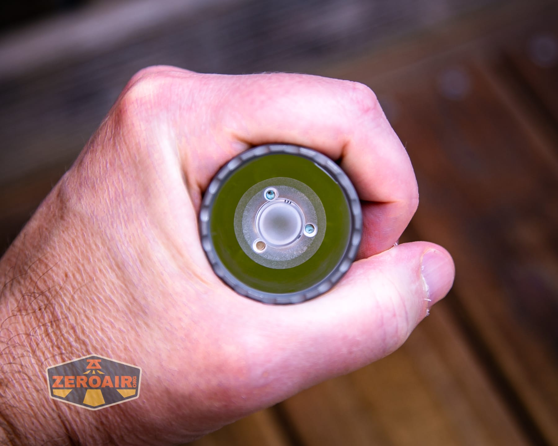 Reylight Dawn Max titanium flashlight in hand