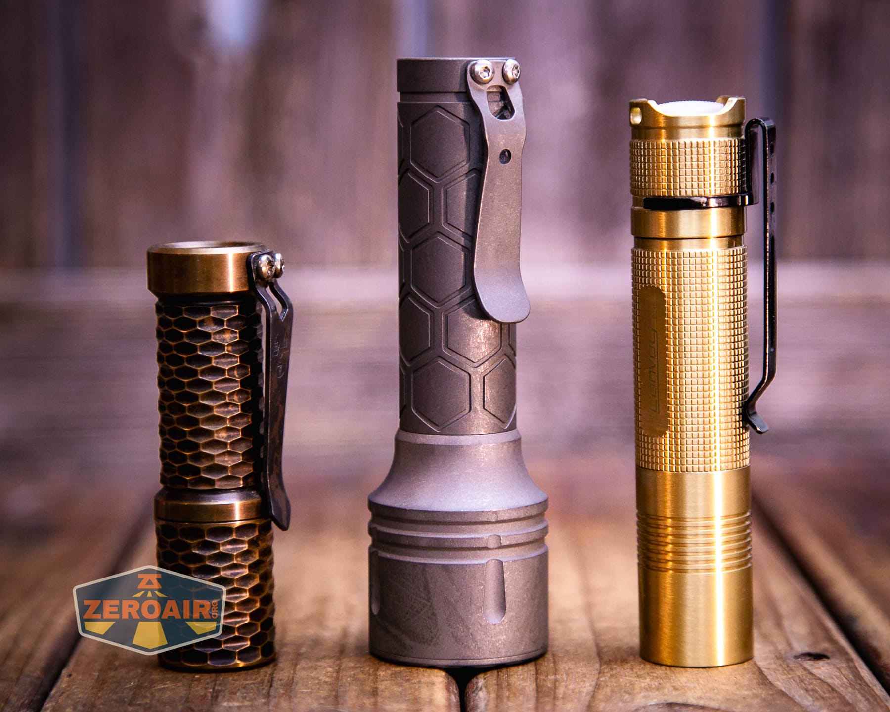 Reylight Dawn Max titanium flashlight with two standard sized flashlights