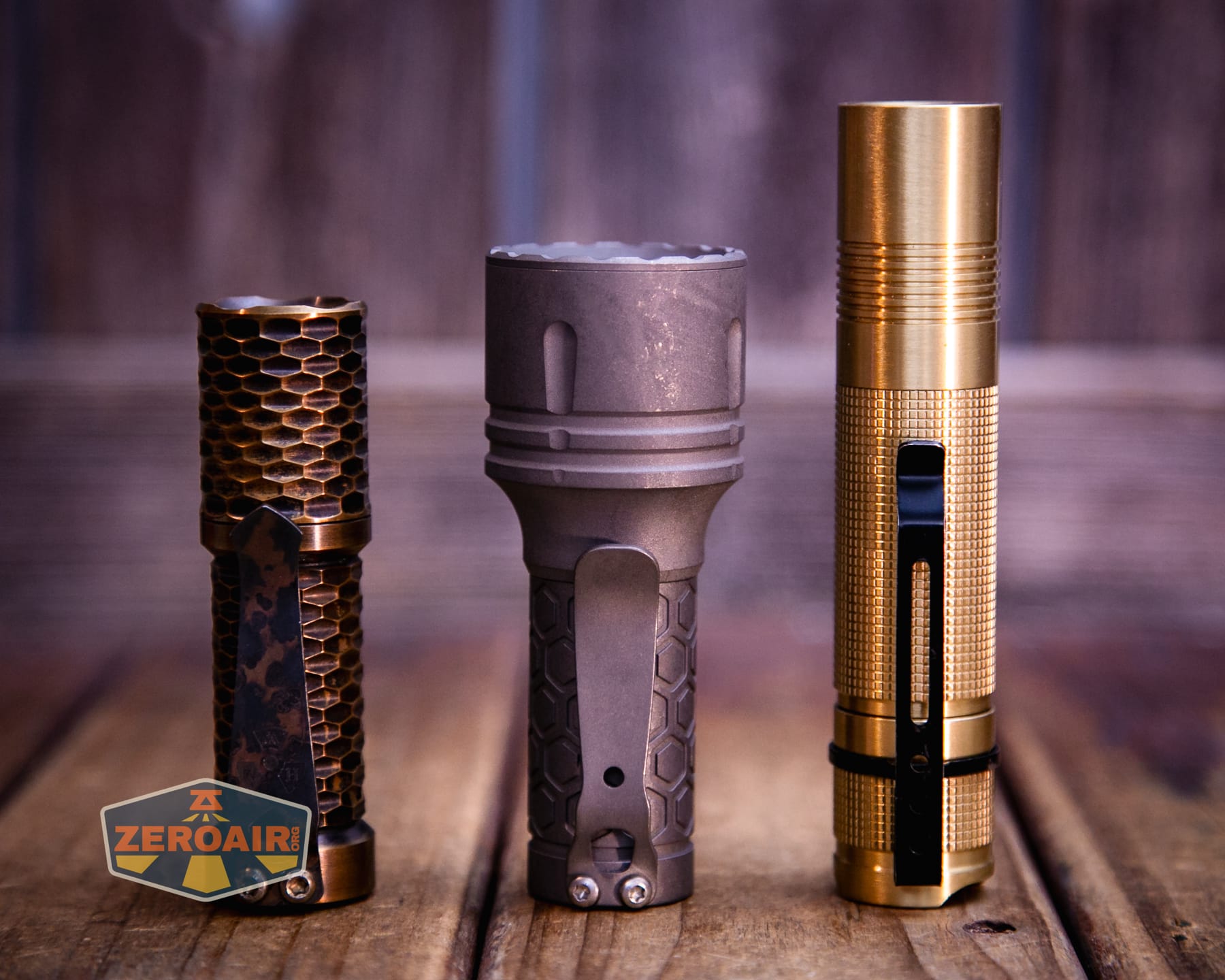 Reylight Dawn Max titanium flashlight with two standard sized flashlights