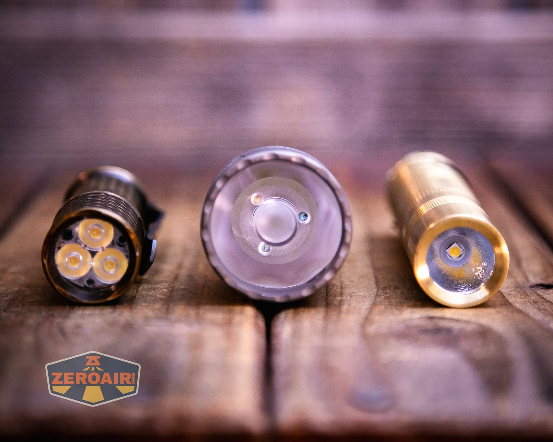 Reylight Dawn Max titanium flashlight with two standard sized flashlights