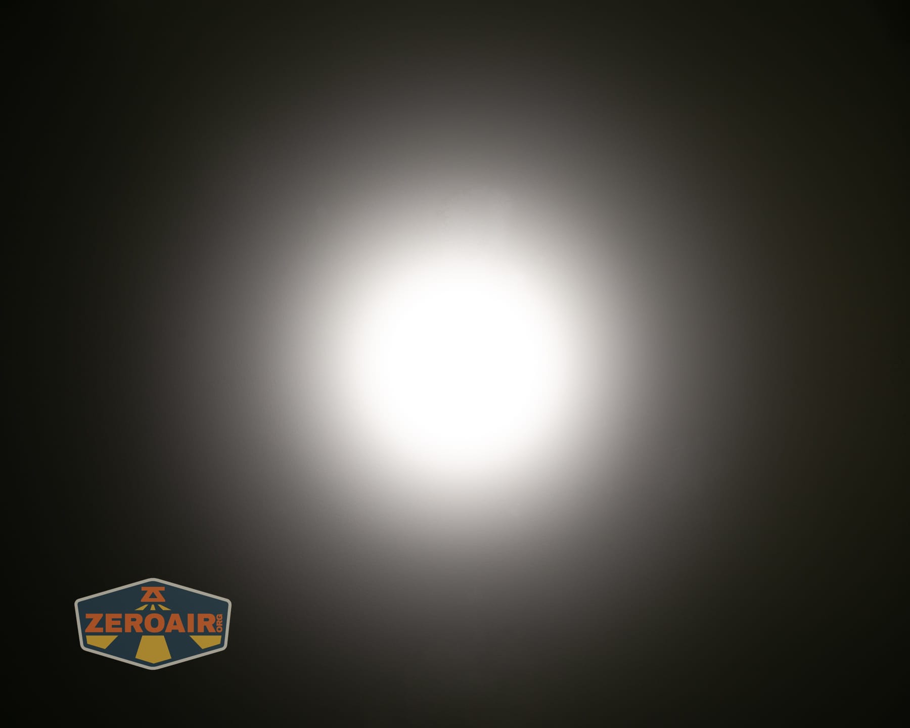 Reylight Dawn Max titanium flashlight beamshots on ceiling