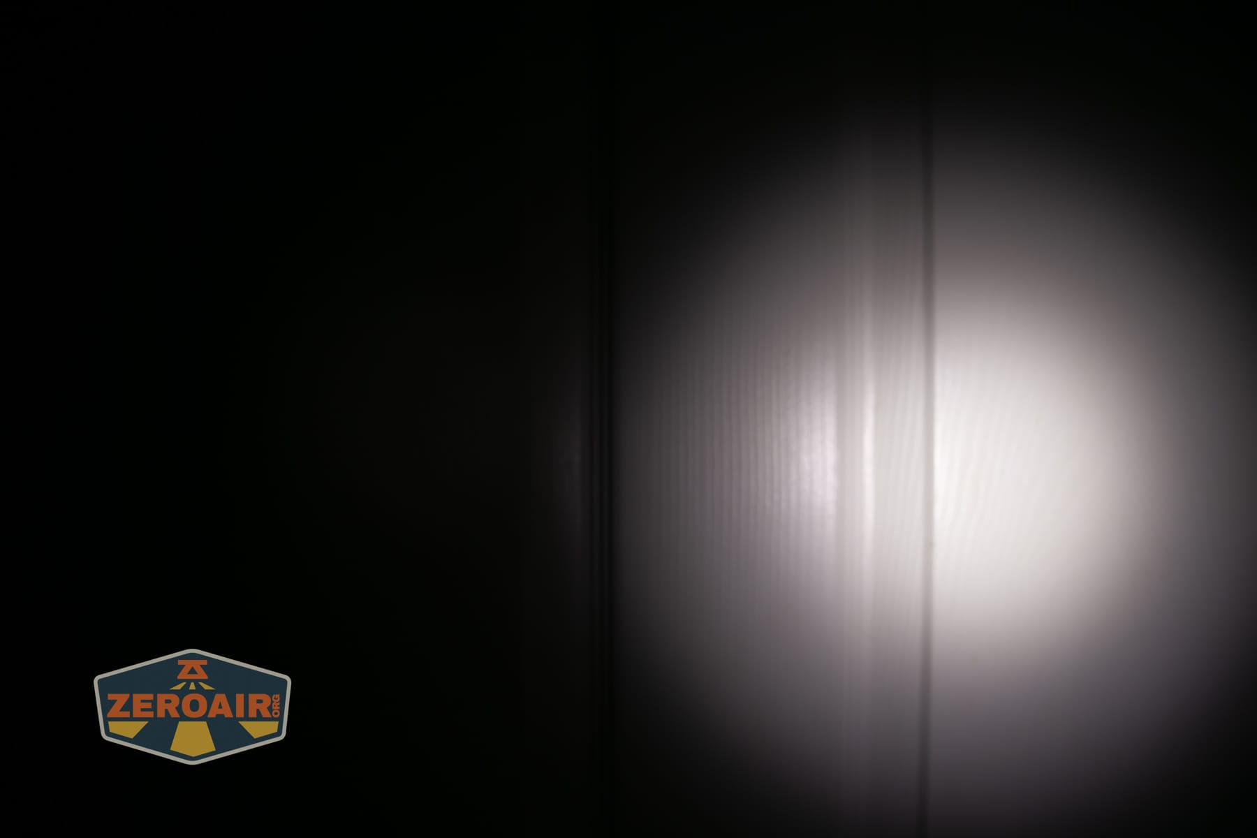 Skilhunt M150 V4 flashlight beamshots on door compared to nichia 219b