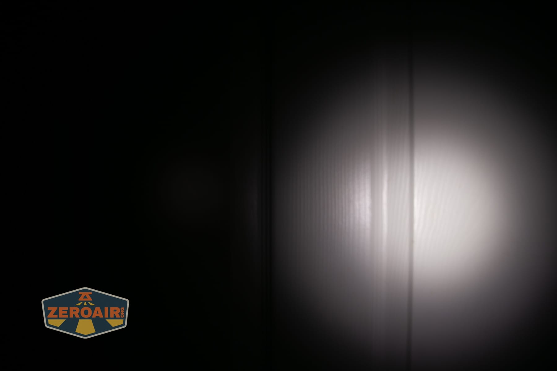 Skilhunt M150 V4 flashlight beamshots on door compared to nichia 219b