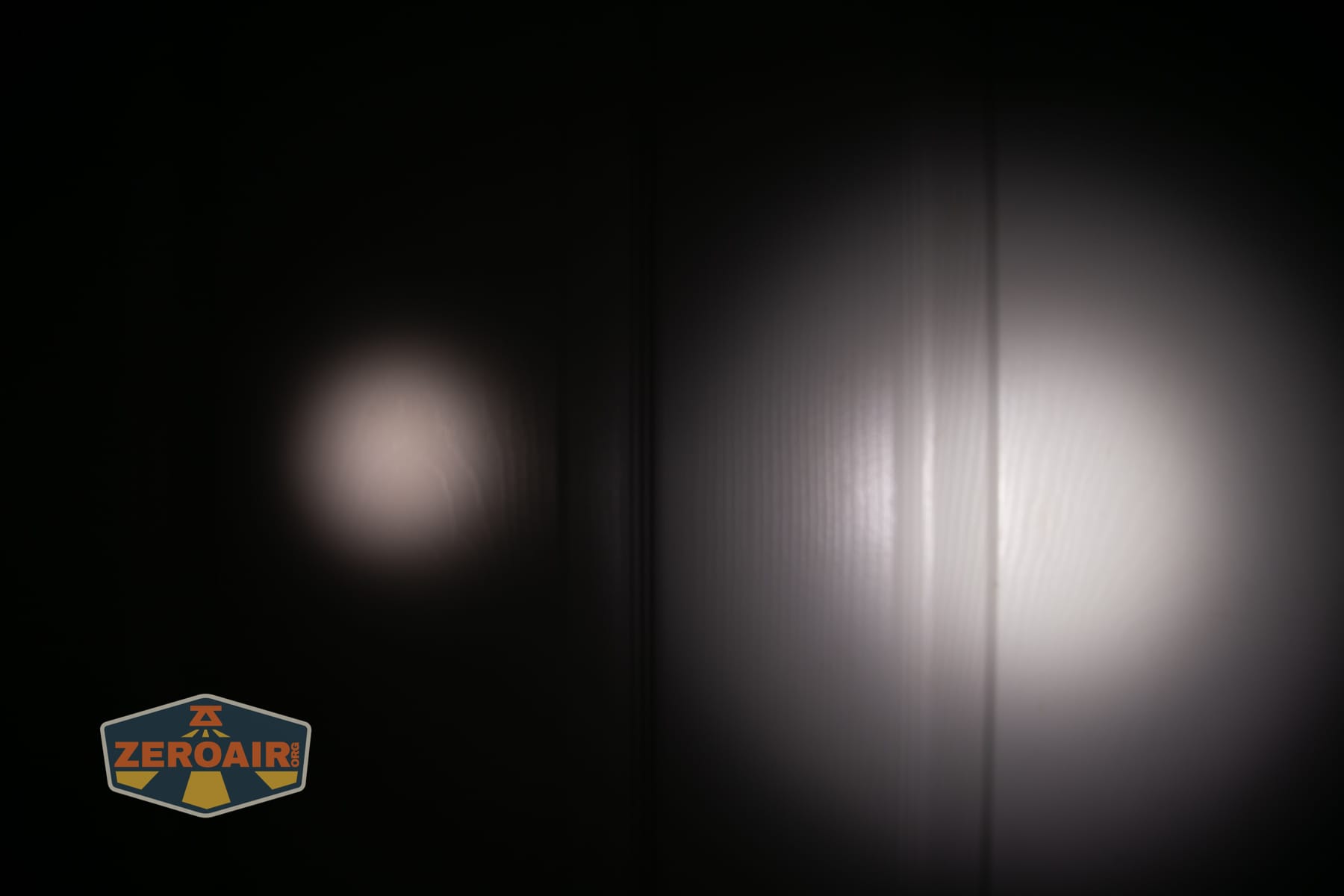 Skilhunt M150 V4 flashlight beamshots on door compared to nichia 219b