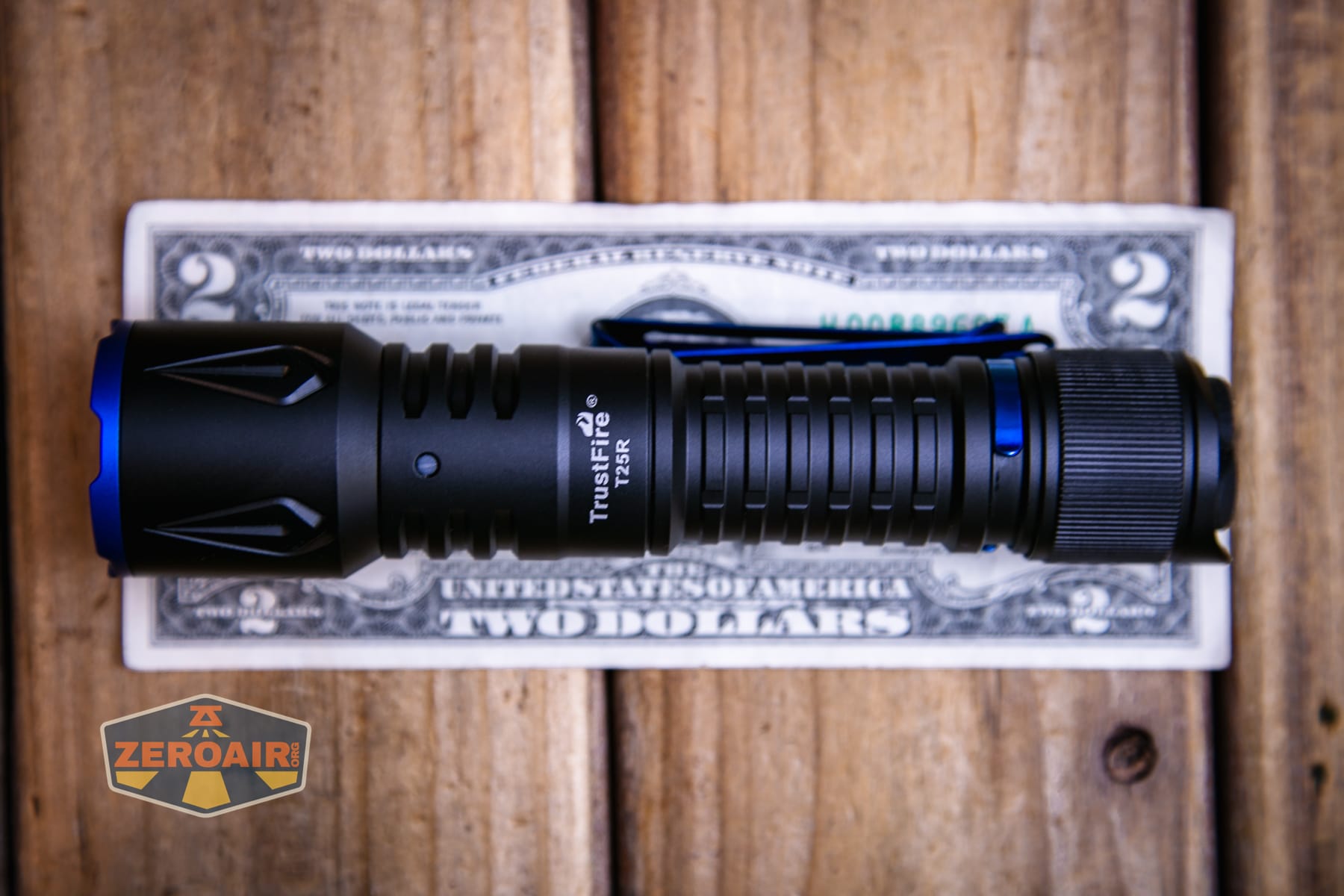 Trustfire T25R tactical flashlight on a two dollar bill