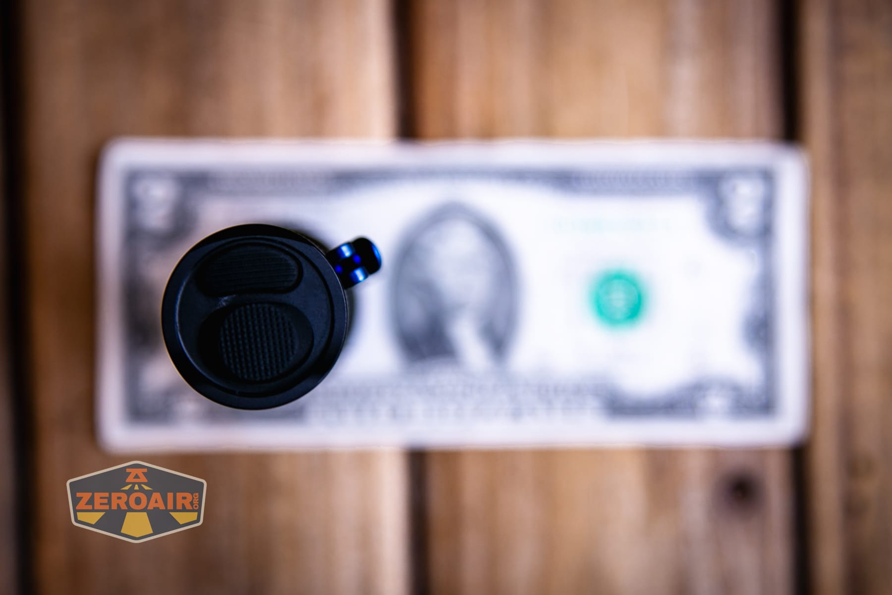 Trustfire T25R tactical flashlight on a two dollar bill