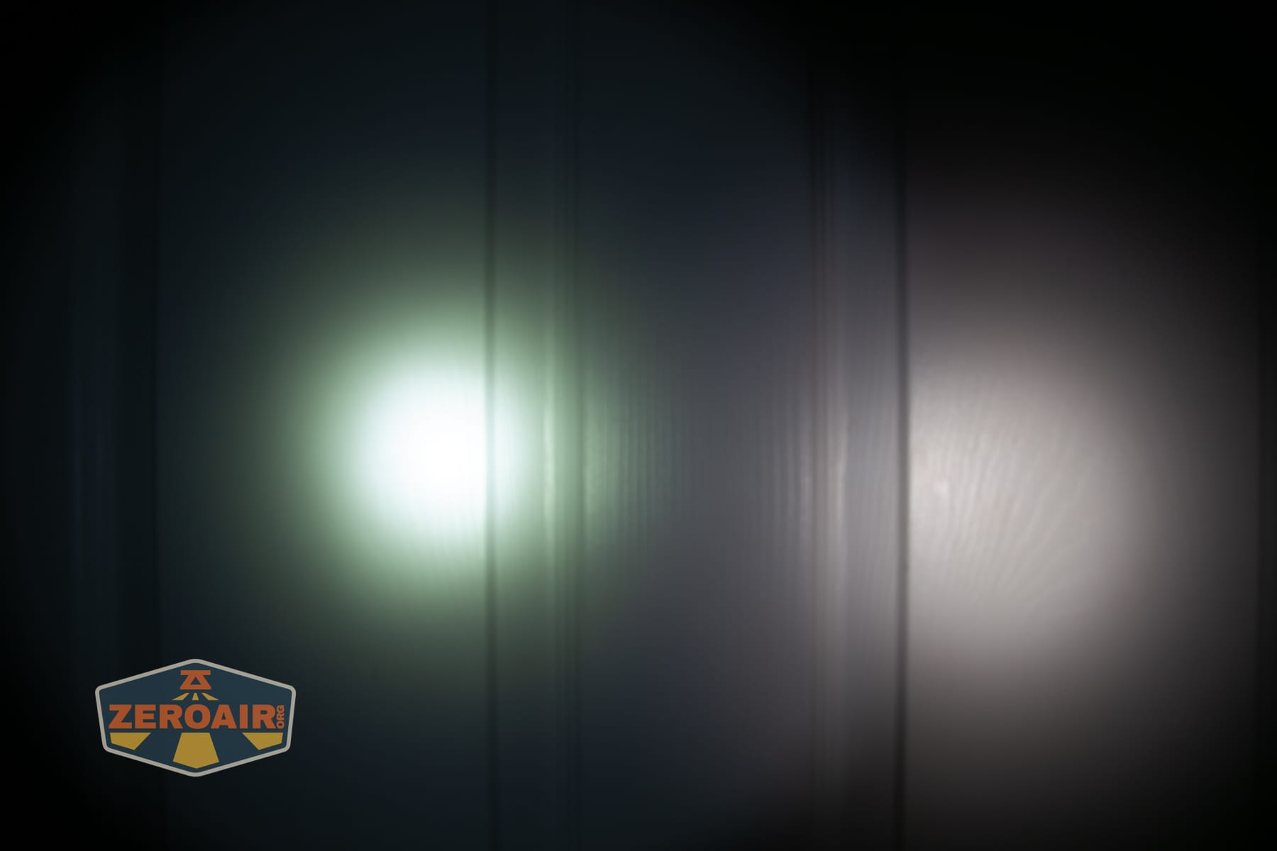 Trustfire T25R tactical flashlight beamshots on door (at 1') compared to nichia 219b 4500K