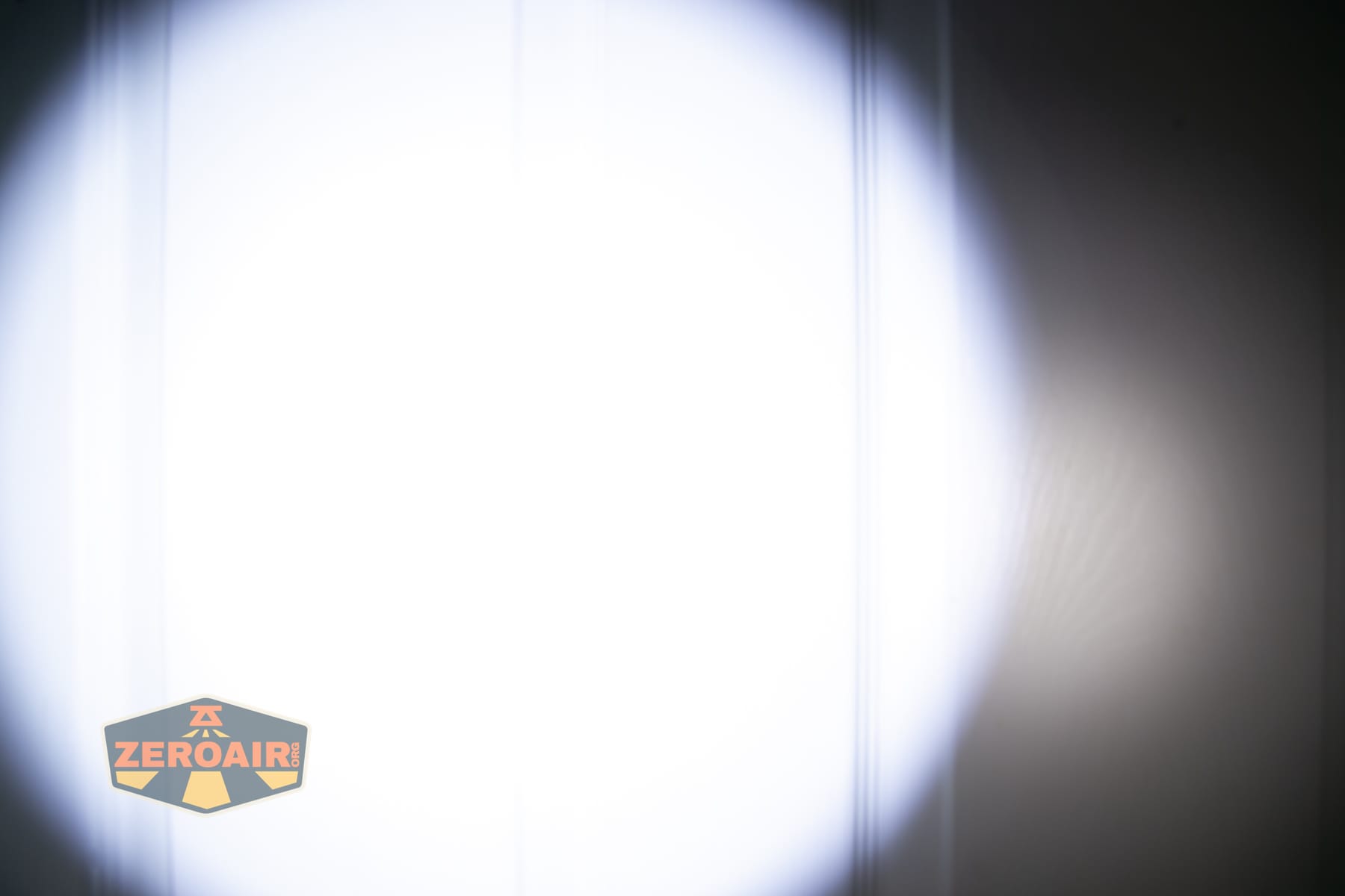 Trustfire T25R tactical flashlight beamshots on door (at 1') compared to nichia 219b 4500K
