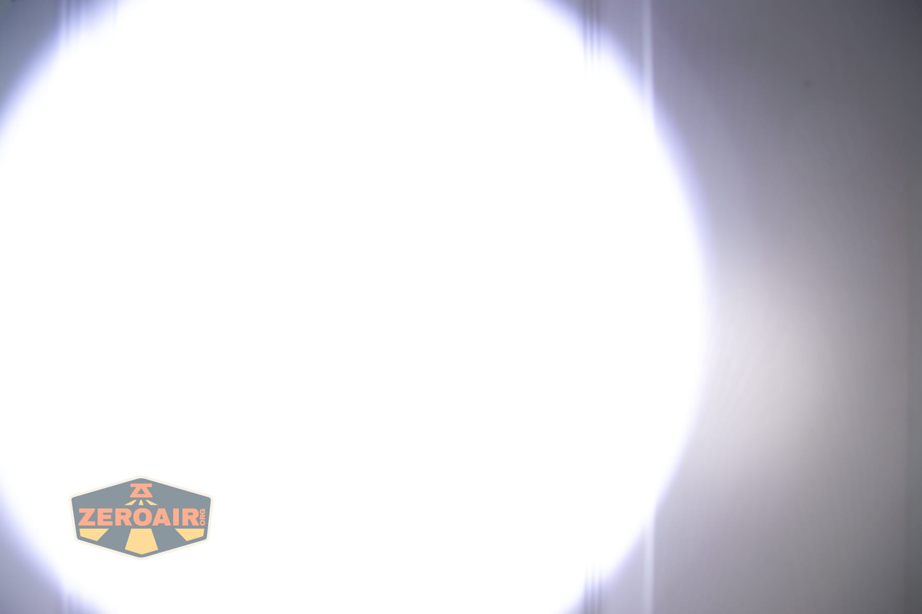 Trustfire T25R tactical flashlight beamshots on door (at 1') compared to nichia 219b 4500K