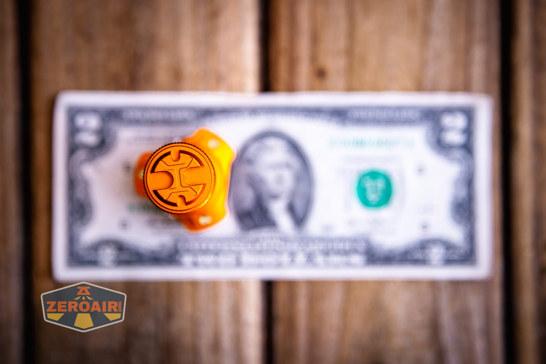 Niwalker ES01 Three Light flashlight on a two dollar bill