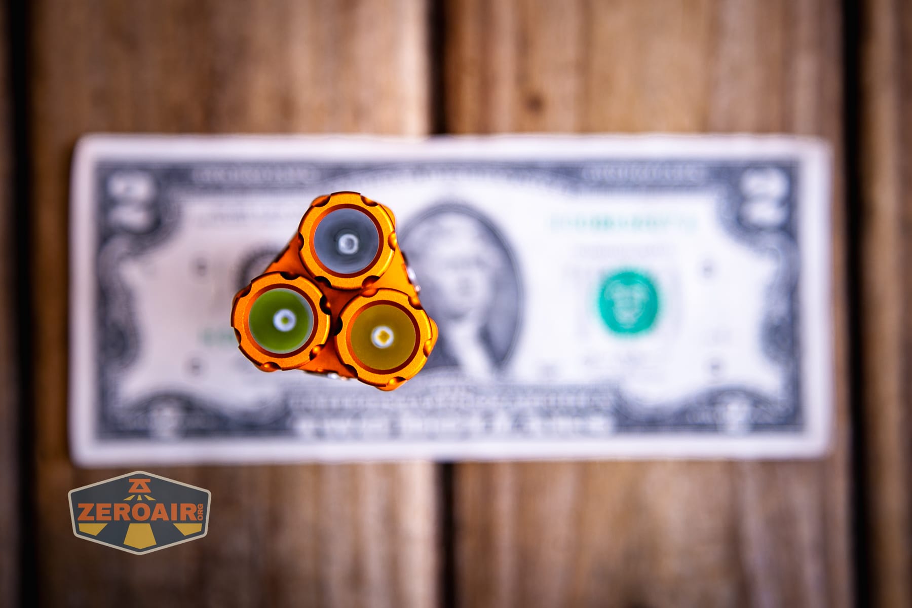 Niwalker ES01 Three Light flashlight on a two dollar bill