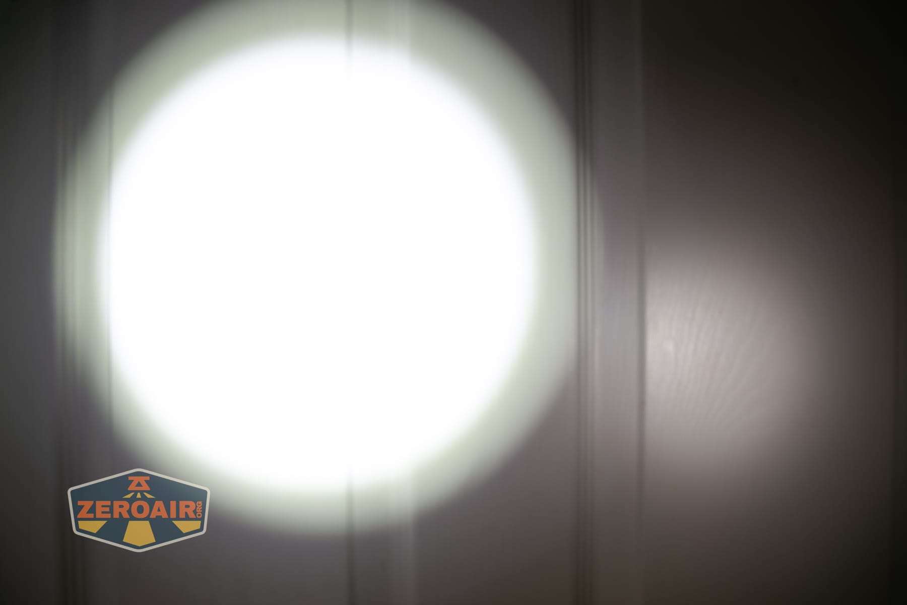 Niwalker ES01 Three Light flashlight beamshots on door (at 1') compared to nichia 219b 4500K