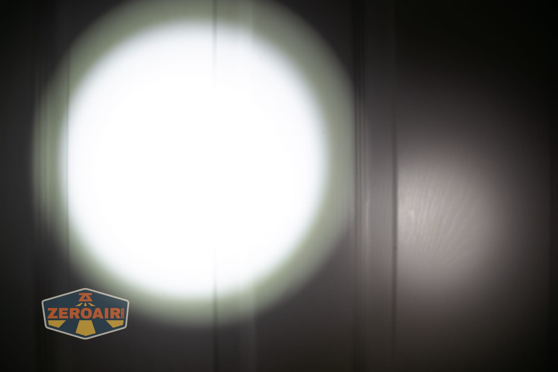 Niwalker ES01 Three Light flashlight beamshots on door (at 1') compared to nichia 219b 4500K
