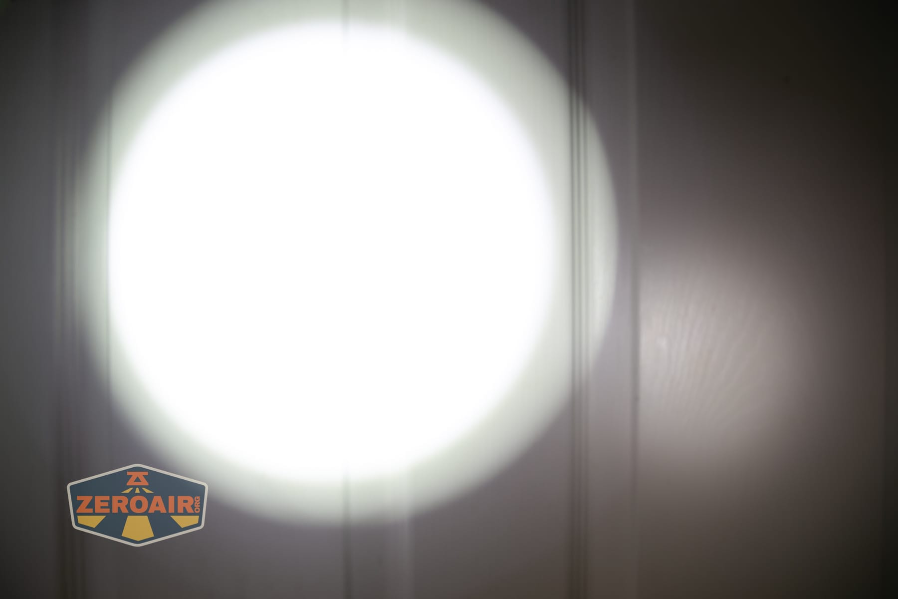 Niwalker ES01 Three Light flashlight beamshots on door (at 1') compared to nichia 219b 4500K