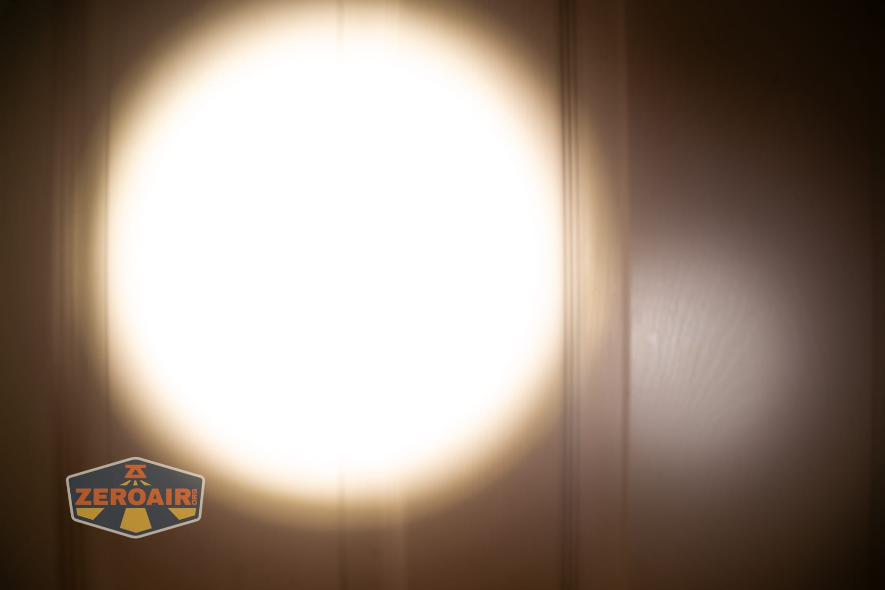 Niwalker ES01 Three Light flashlight beamshots on door (at 1') compared to nichia 219b 4500K