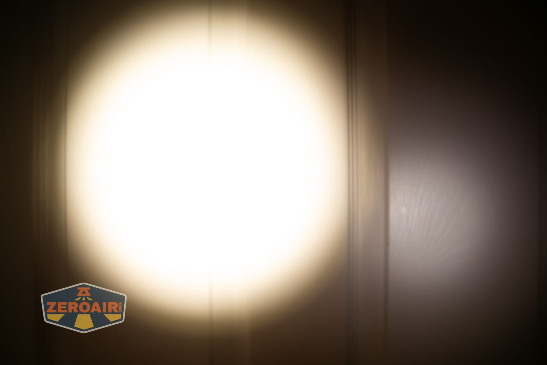 Niwalker ES01 Three Light flashlight beamshots on door (at 1') compared to nichia 219b 4500K